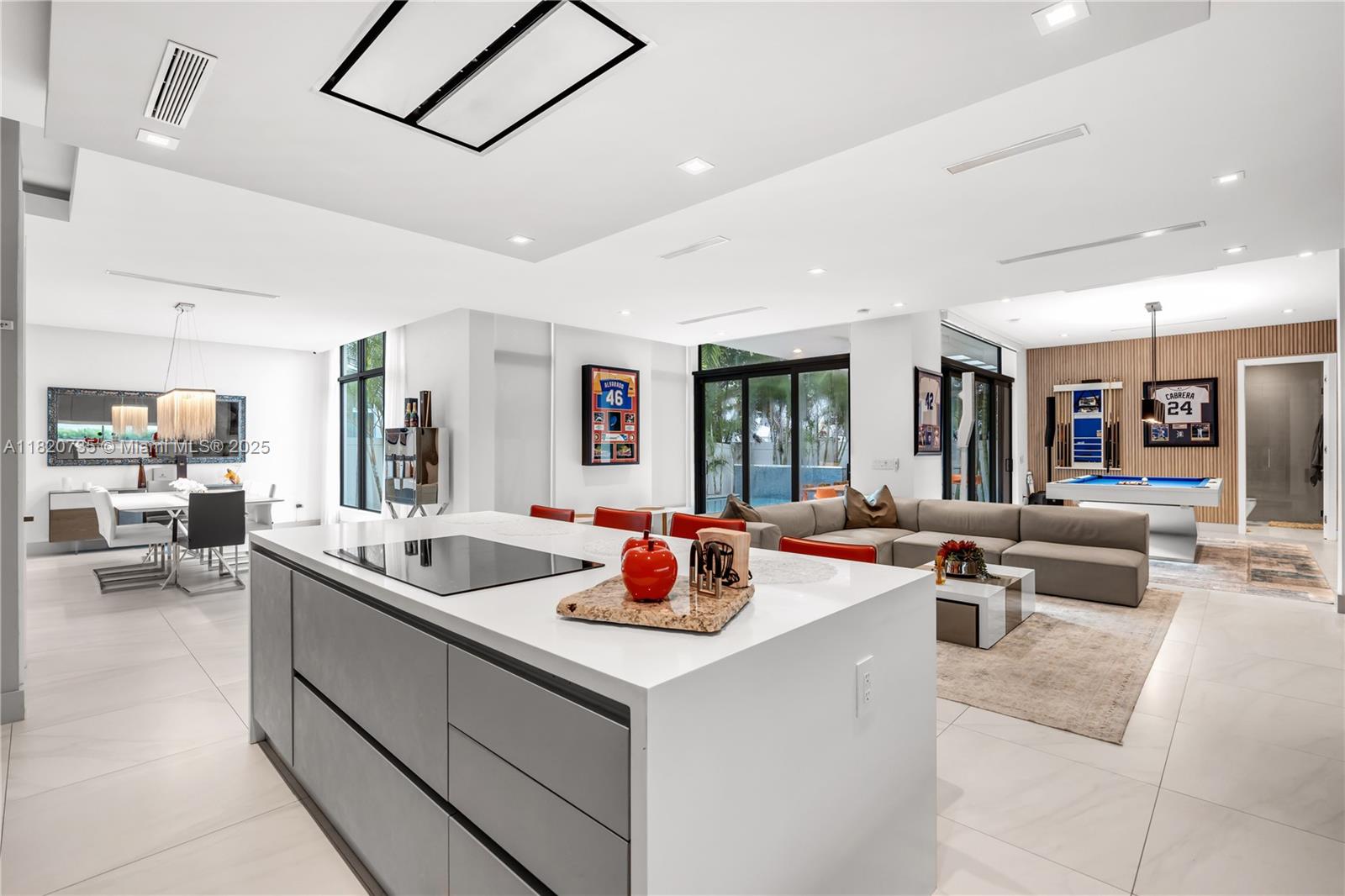 THIS HOME IS A ONE OF A KIND, IT'S A MUST SEE!!! This incredible Mansion is part of the newest collection "Hybrid" of certified green homes that combine luxury and sustainability; built with the latest eco-friendly materials, these homes create a new lifestyle experience. Two-story, 4,138 SF, 5 Bedrooms, 5.5 Bathrooms, w/ sophisticated finishes & upgrades: double-height ceilings in living area, glass staircase, outdoor living area with summer kitchen and pool with a waterfall feature. Custom Italian kitchen w/ SubZero/Wolf appliances, walk-in closets, high-impact windows, complete house water filtration system, security cameras & alarm, large garage. Exclusive gated Community also includes a state-of-the-art gym and kids' play area. Home can be sold furnished.