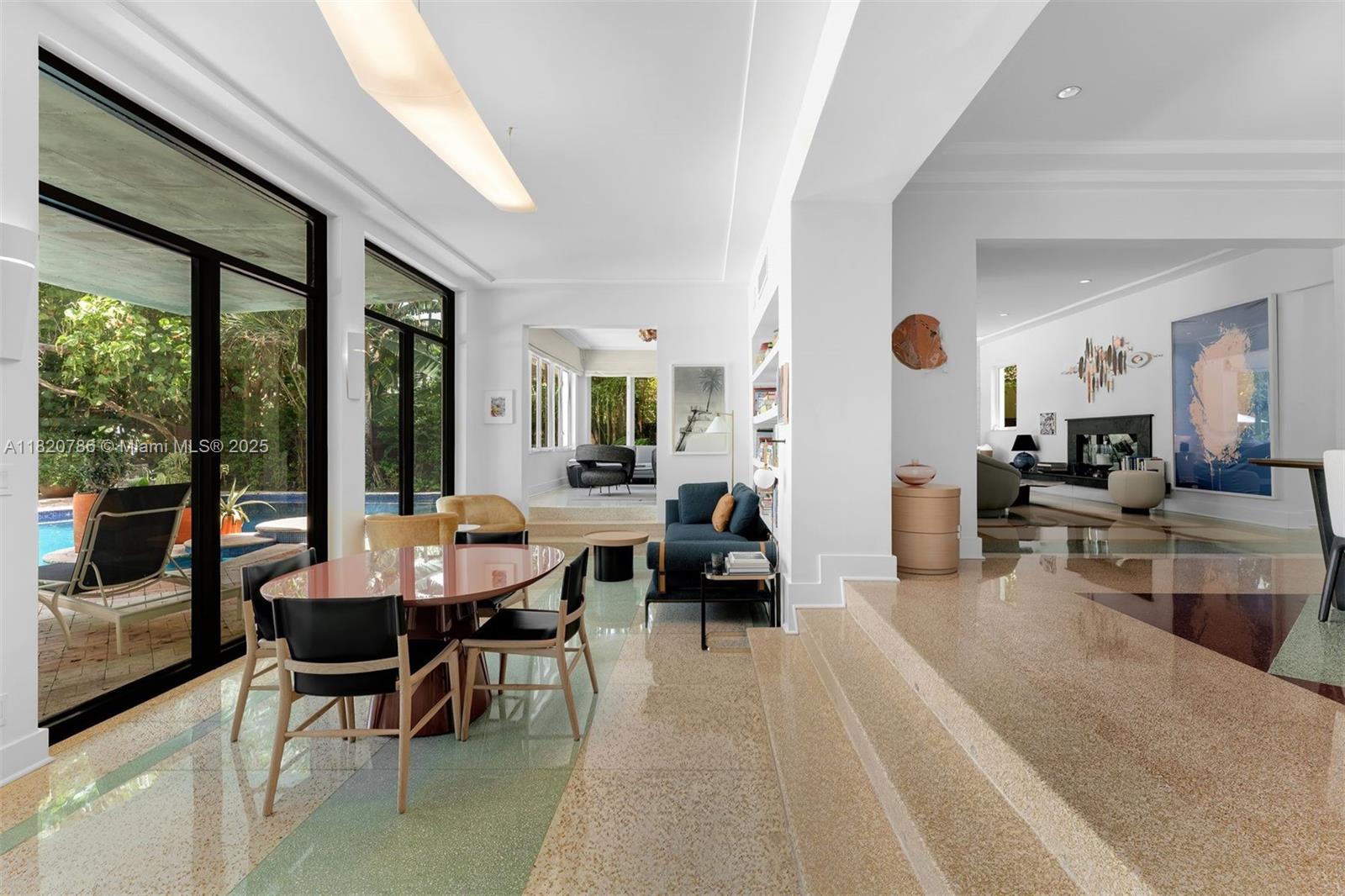 Experience timeless Art Deco living at this gated, furnished & elegantly renovated Miami Beach home. Set on a spacious lot w/ room to expand & 75 ft of wide canal frontage & no fixed bridges to the ocean, this waterfront estate offers seamless indoor-outdoor living in one of the city's most desirable enclaves. This curated home features a private dock w/ 16K lift, heated pool,12 ft ceilings, terrazzo floors, impact windows, gas cooking & Miele appliances. Exquisitely designed interiors offer multiple living spaces, media/den & gym. Luxurious primary suite on the 2nd floor w/ dual closets, sitting area/office & balcony w/ water views. Separate access to a 3rd guest suite or gym. Premier location on prestigious Pine Tree Drive near Bal Harbour Shops, South Beach & La Gorce Country Club.