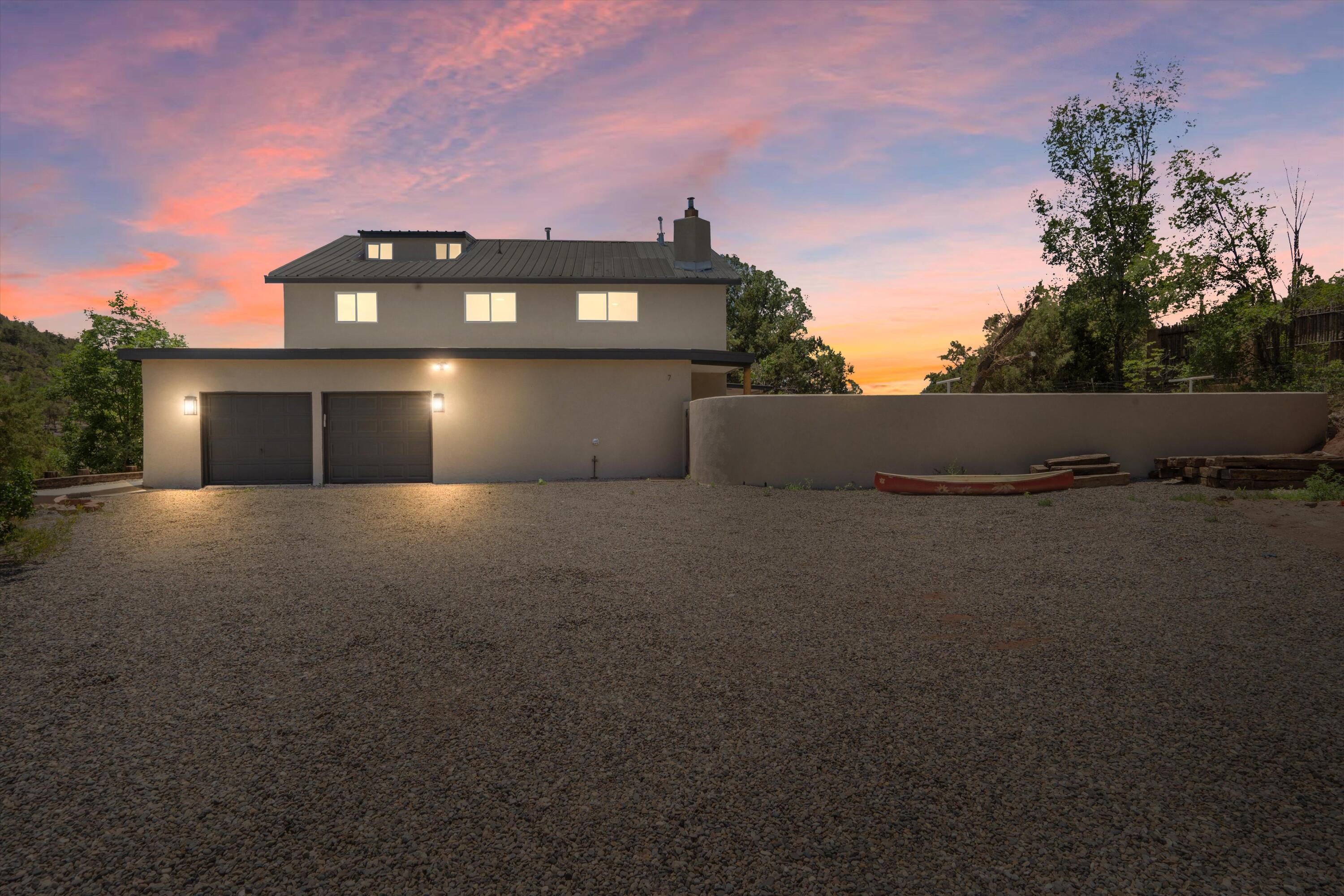 Spacious Mountain Villa on Nearly One Acre!Tucked away in a peaceful and secluded setting, this impressive 5-bedroom, 4-bathroom home offers room to breathe and space to grow. All updates have already been completed, and the potential here is incredible. Inside, you'll find soaring vaulted ceilings, a grand oak staircase, and oversized rooms throughout. The eat-in kitchen is perfect for casual meals, while a third-floor loft and an additional 400 movie room or any added valuable bonus space. Enjoy outdoor living with a large covered patio, fenced yard, and multiple outbuildings--ideal for hobbies, storage, or workshop use. With a 2-car garage and a generous two-story layout, this home is a rare find. Don't miss your chance to own this mountain retreat with room for everyone!