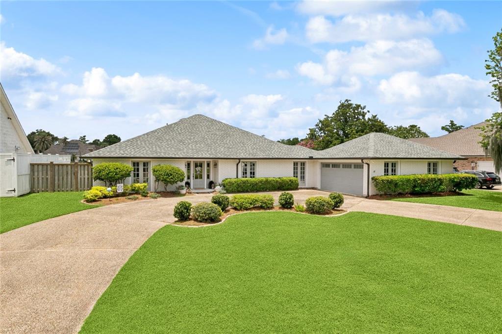 Welcome Home to this stylishly updated property in sought-after Ormond Estates! With expansive Golf Course views and a recently installed fence, this home is great for family gatherings and relaxing weekends! Featuring 4 spacious bedrooms with large closets and 2 updated bathrooms, this home offers a blend of charm in an airy layout. Dozens of recent updates include new flooring, windows, roof, garage door, front and side entry doors, and designer paint colors throughout, making this home truly move-in ready! An expansive sunroom drenched in natural light opens seamlessly into the oversized living room, anchored by a timeless brick fireplace. Priced to impress in a family-friendly neighborhood, it's the most affordable home you will find on the golf course! Your next home and next chapter start here!