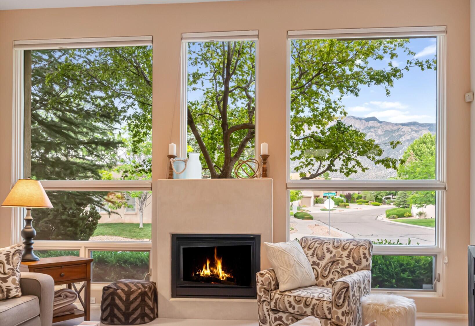 Breathtaking Mountain Views in Primrose Pointe! Enjoy panoramic Sandia Mountain views from your living room, breakfast nook, or even while washing dishes in this thoughtfully positioned single-story home. Designed to bring the outdoors and natural light in, this home features walls of Pella thermal/double-pane windows and doors, 11 skylights, and a serene private patio and backyard. The smart floor plan separates the spacious primary suite from a three-bedroom wing--ideal for guests, roommates, or multigenerational living. The gourmet kitchen is the heart of the home, complete with a large eat-in island, granite counters, stainless steel appliances, and abundant storage. With a new roof, updated mechanicals, and fresh skylights, all that's left to do is move in and soak up the views!