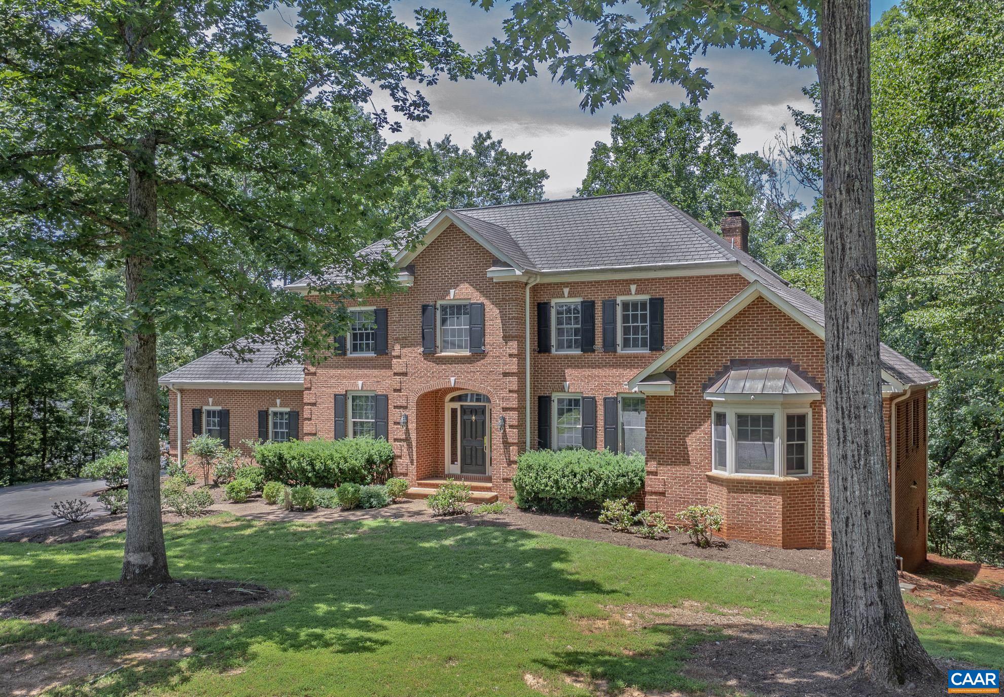 Privately situated, this stately all brick architecturally designed home on almost 3/4th of an acre, within walking distance of the clubhouse, tennis courts, pool and fitness center is now available. Conveniently located off the living room is the impressive library/study, custom built with floor to ceiling cherry cabinets/bookcases and flooring. The large sunny first floor primary suite is accompanied by a stunning primary bathroom. The Great open kitchen and family room includes a vaulted ceiling, cozy fireplace, large, oversized island and granite counter tops, Thermador gas cooktop and more. In the full finished terrace level is a convenient guest suite. Two walk-in attics, large two car garage and beautiful deck are just some of the attributes that contribute to everything that makes this house a beautiful home with great entertainment possibilities.