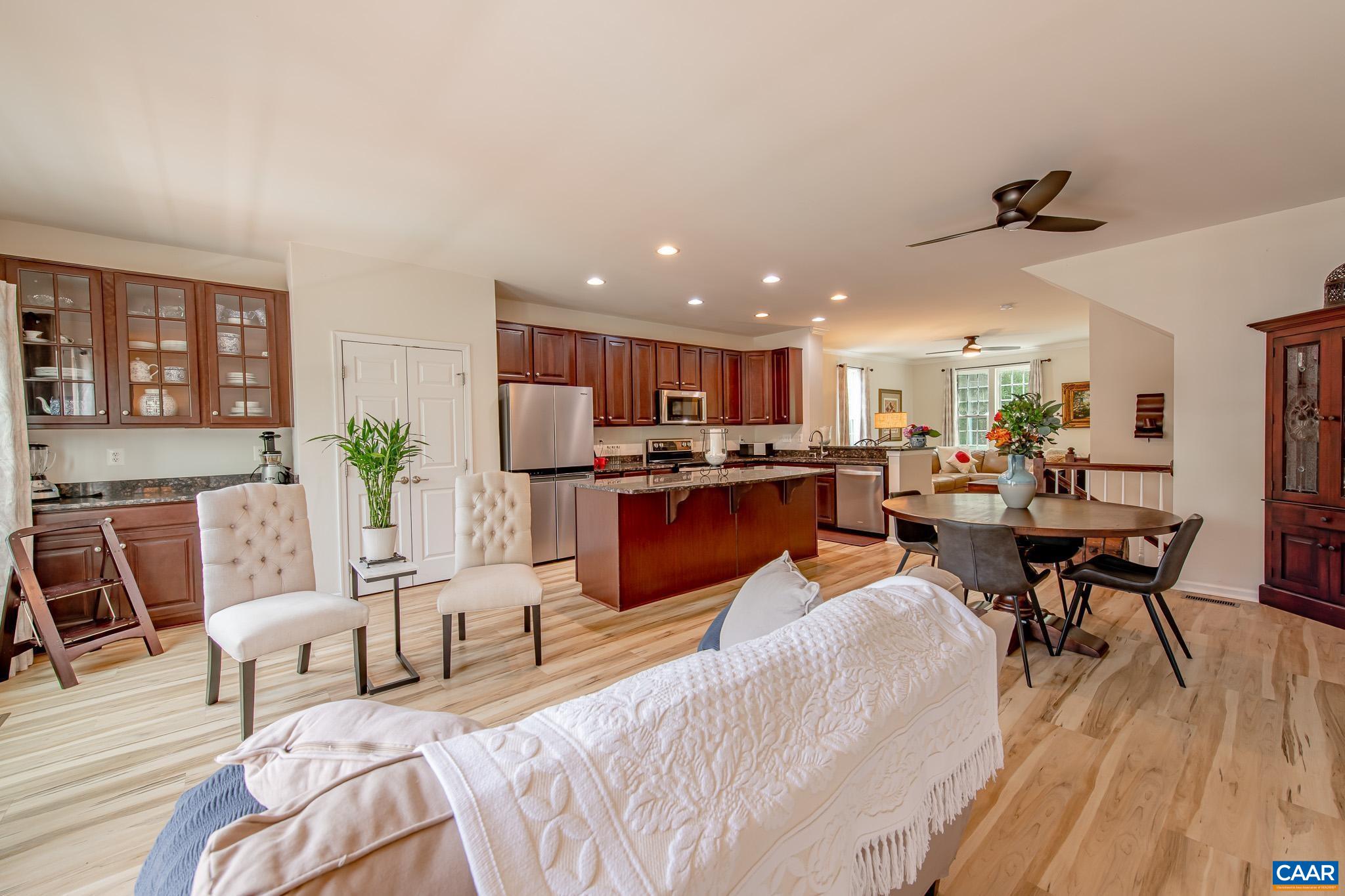 You don't want to miss this spacious, end-unit townhome in the desirable Western Albemarle neighborhood of Liberty Hall.  Tastefully upgraded with new LVP flooring on all 3 floors, fresh paint, new SS appliances, new deck boards, and new ceiling fans.  Not only does this home provide over 2300 Fin SF and a garage, it also backs to large common space that lends to a sense of peace and privacy rarely found in a townhome.  Walkable to Harris Teeter, doctor and dentist office, restaurants and shops and only a few short minutes from the heart of Crozet and serene Mint Springs Park with its lake, beach, picnic grounds, walking trails and play areas.  Attractive to those looking for a turnkey property to call home as well as to the investor. Most furniture for sale; inquire for details.