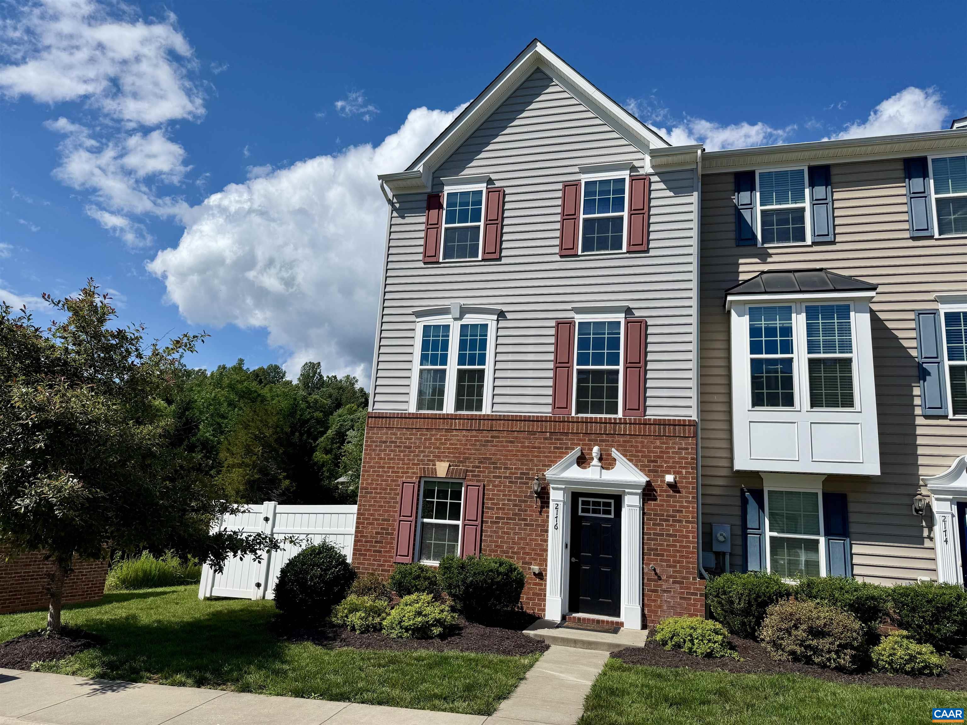 OPEN HOUSE Sun 6/22 from 1-3pm. Best location and value in the Pavilions at Pantops neighborhood for this move-in ready end unit townhome with unrestricted waterfront and Blue Ridge Mountain views. Open-concept layout that combines a bright living room with a stylish kitchen and dining area that opens to a private balcony. The kitchen features granite countertops, 2023 GE stainless steel appliances, breakfast bar, and pantry.  Top floor offers a spacious primary suite featuring a tray ceiling, walk-in closet, and private ensuite bath. Two additional generously sized bedroom includes two closets and easy access to a full hall bath. Laundry located on top floor for added convenience as well. Terrace level features a versatile bonus space along with enclosed home office space and half bath.  Step outside to a private rear deck and fenced backyard that is perfect for entertaining, relaxing, or letting pets play. Located steps away from Darden Towe park and minutes from Downtown Charlottesville, UVA, and major medical centers, with easy access to I-64 and all things Pantops. The only townhome in Pavilions offering both water and Mountain View’s from an end unit! Video and 3D tours links available by request.