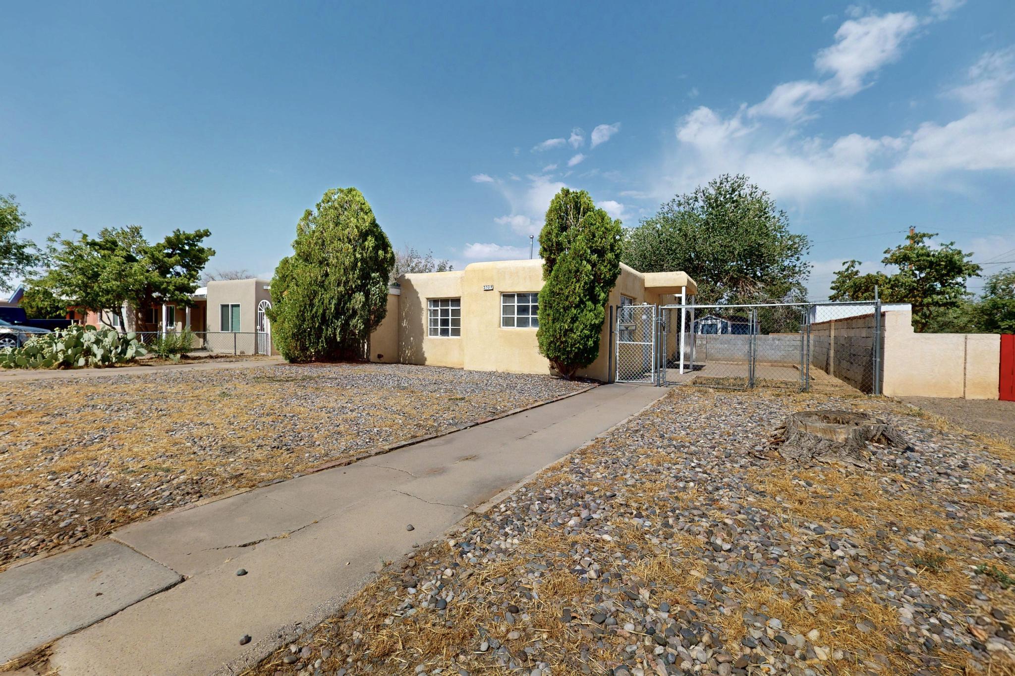 Opportunity knocks in a prime Uptown location! This 3-bedroom home is your chance to own in one of Albuquerque's most convenient areas--just minutes from shopping, dining, and I-40 access. Inside, you'll find a cozy fireplace and versatile living space ready for your personal touch. The spacious backyard features alley access, a 2 storage sheds, and room to grow. Whether you're a first-time buyer or investor, this property offers solid value and potential. Priced under $300K--don't miss out on this Uptown gem with great bones and even better location. Schedule your showing today and take the first step toward homeownership!