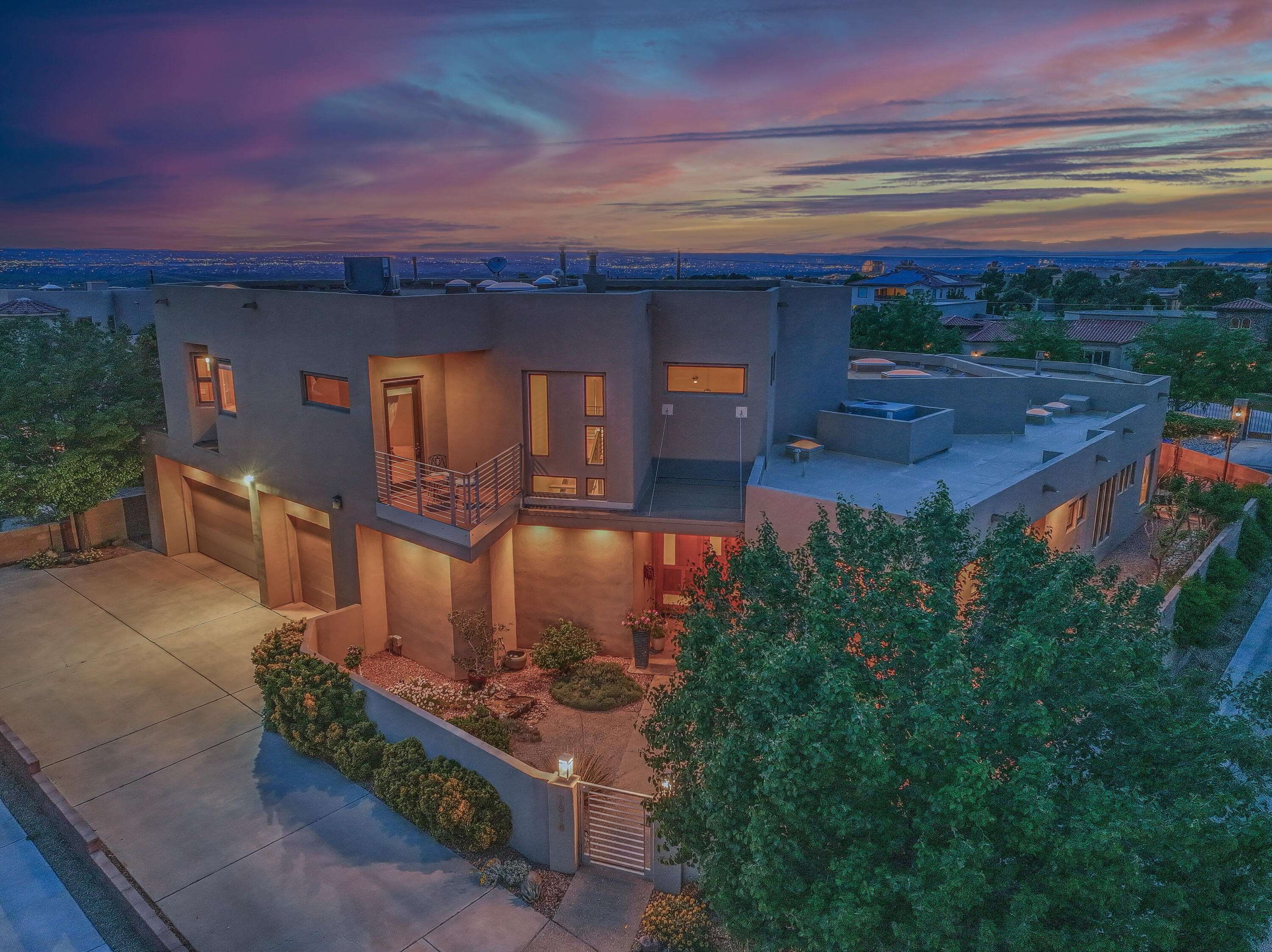 Introducing an exquisite residence located in North Albuquerque acres. High ceilings welcome you into the vast living room with open concept living. Thermador gas cooktop, dbl ovens, 2 dishwashers, modern wood cabinetry plus a large pantry complete the kitchen. The primary suite has a beautiful mountain view, laundry in the closet, walk in shower, and dbl vanities. Additionally downstairs is an office with access to the backyard plus a guest bedroom and bathroom. Upstairs enjoy the balcony with mountain views plus the loft space. Two bedrooms are adjoined with a shared bathroom and an another bedroom with en-suite bath. Open the glass sliding doors and bring the outdoors in. Enjoy the views from the backyard and cool off in the pool from the Albuquerque heat. North Star/La Cueva schools.