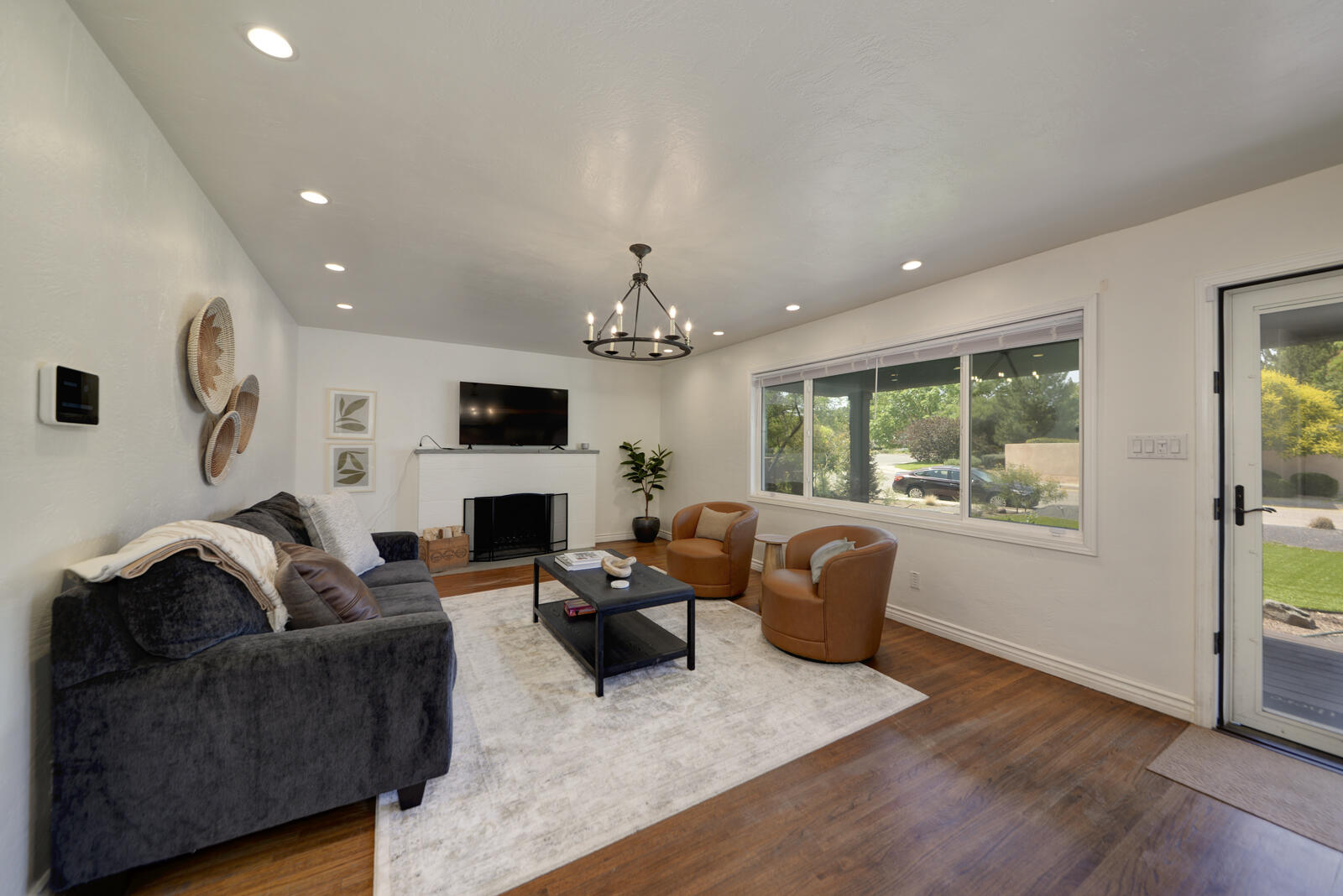 Stunning UNM area Contemporary Home  in popular Twin Parks/Hidden Park Neighborhood. Generous living spaces come together to create a perfect blend of casual livability grounded with the peaceful serenity of flowing harmony. Spacious Kitchen is a chefs delight with large island, well appointed appliances + upscale features! Primary is a true retreat: private study, spa inspired bath & private access to exterior! Second bedroom is ensuite  also a 3rd bedroom, office + bath #3 - WOW! Great Options for the EXTENDED FAMILY!! Updates: CFA, A/C, roof, windows, plumbing, recessed lights, modern light fixtures. Private secluded backyard w/open patio & gardening possibilities! Enjoy weekends - low maintenance xeriscape  landscaping!  Close to UNMH, Nob Hill, Shopping & more!  Garage not full sized