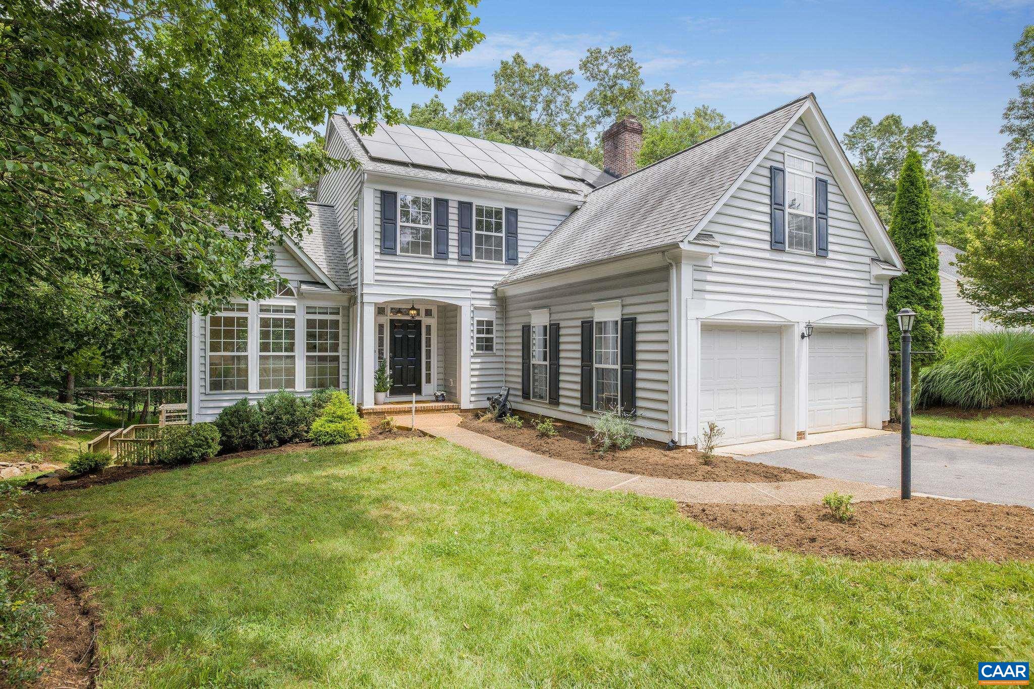 DUNLORA LIVING! Located adjacent to the neighborhood Pool and Clubhouse, this 4 bedroom home delivers space, flexibility, and fun in a sought-after community with walking trails, tennis, open fields, garden spots, and easy access to all things Charlottesville. The main level offers a smart layout with formal and informal living areas, an eat-in kitchen, and a separate dining room. Upstairs you’ll find 4 comfortable bedrooms, 2 full baths, and the convenience of an upstairs laundry. Downstairs, the walkout basement includes a full bath and a large finished space perfect for movie nights, guests, playtime, or even a 5th bedroom suite plus unfinished storage. Out back, a surprise awaits: a professionally installed, structurally sound swing set anchored to a horizontal telephone pole (inspected in 2022), plus a basketball court for hours of fun shooting hoops. There’s even a zip line launch platform which hints at future adventure. A deck and screened porch offer outdoor lounging, and the low-maintenance yard keeps weekends free. This home just feels right — it’s well-located, solidly built, has solar panels, is packed with personality/possibilities.  Move-in ready with early occupancy available. Come see what all the fuss is about!