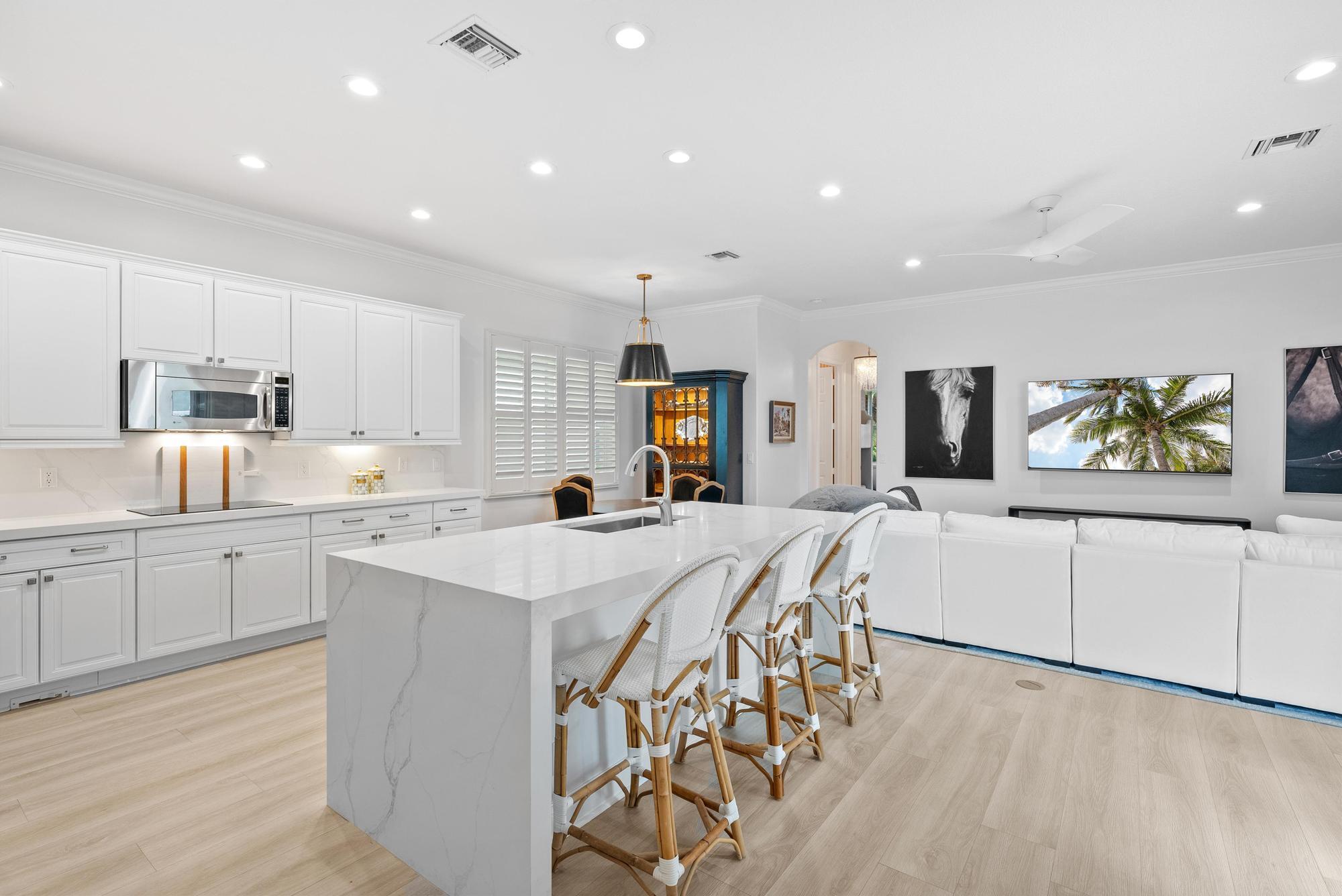 Rarely available one-story home in a highly sought-after gated community with access to a private clubhouse, pool, and gym. This beautifully renovated home features a stunning kitchen with mitered quartz countertops, a waterfall island, and all-new flooring throughout. Enjoy remodeled bathrooms with designer fixtures, luxury wallpaper, and fresh paint. The backyard offers a completely renovated heated spa with LED lighting, a waterfall feature, and a new heater--perfect for relaxing year-round. An oversized garage adds extra storage and convenience. Don't miss this exceptional opportunity!