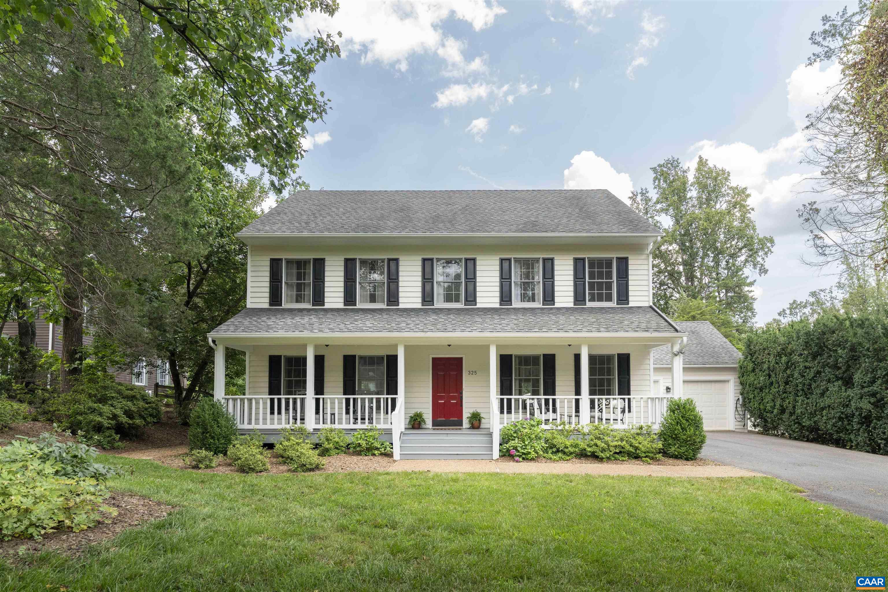 Open House 7/26 1-3PM. Located in the Murray school district, just minutes from I-64, UVa & downtown Charlottesville, this impeccably maintained home offers the perfect balance of convenience, privacy, and timeless style on a sunny and partially wooded 0.67 acre lot. The elegant, well-designed floorplan lives large and features four spacious bedrooms, hardwood floors throughout, formal living and dining rooms, updated baths, fresh paint, and a generous renovated kitchen complete with an island, breakfast area, and wet bar.  The primary suite impresses with cathedral ceilings and chic ensuite bath, while thoughtful touches like a versatile drop zone, tucked away staircase, bedroom-level laundry, storage shed, and main-level 2-car garage w/ EV charger add everyday ease and function. Exceptional outdoor living awaits with an expansive deck overlooking a sparkling heated pool and lush fenced yard—ideal for entertaining or quiet relaxation in a peaceful, natural setting. For a minimal HOA, Peacock Hill includes walking trails, a community pond, tennis and pickleball, playground and trash service. Enjoy the rest of your summer in this move-in ready Ivy oasis.