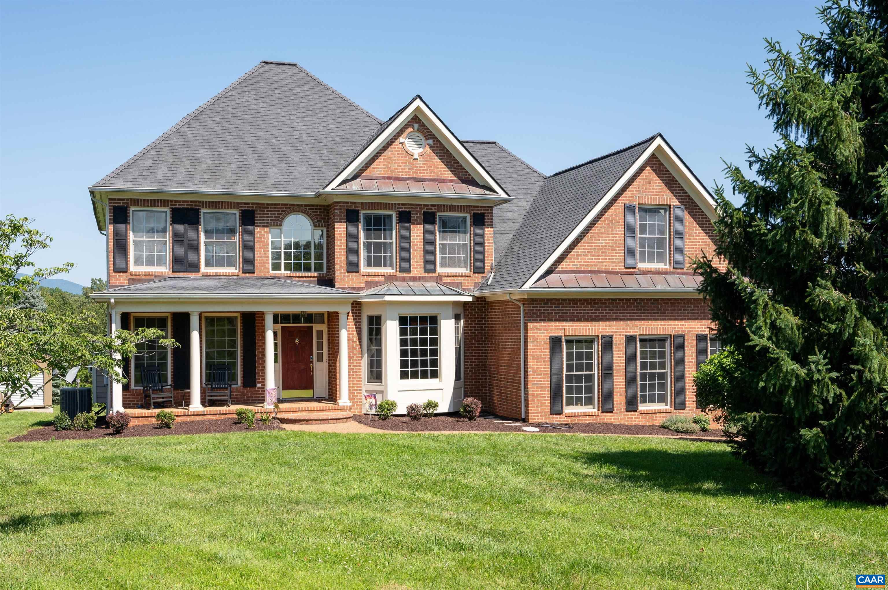 Your dream home awaits in this spectacular setting with mountain views & the perfect blend of comfort & elegance! Enjoy beautiful hardwood floors throughout the main level, & a chef’s kitchen equipped with stainless steel Kitchenaid appliances (2022-2023). Step outside onto a spacious deck with a retractable awning overlooking your private land, or relax in the screened porch off the kitchen - ideal for outdoor living. The upstairs features a sprawling primary suite with a spacious sitting area, luxurious ensuite bathroom, & a huge walk-in closet. Two additional bedrooms & a full bath provide ample space for family or guests. Recent upgrades include a new heat pump (2024), Samsung washer and dryer (2021), & a 26x12 storage building on a concrete pad (2023). Stay connected with Brightspeed internet and power up your electric vehicle with a 60 amp Tesla charger outside the garage. The walkout basement offers a spacious in-law suite, perfect for extended family or rental potential. This exceptional home, combining modern updates with serene surroundings, is only 20-25 minutes from UVA.