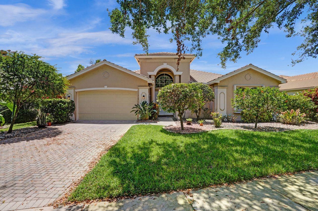 Repositioned price to Sell. Owner wants a Contract now!.Rarely available Marbella model w/long lake views of highly desirable Guard Gated Community of Valencia Isles of Boynton Beach. Community States 55+. Grand double door entry to this very well maintained home over looking tranquil lake ,marble floors throughout the living area & high quality laminate floors in the bedrooms. Built in 2001 this home boasts state of the art newer stainless steel appliances, granite counters & beautiful wood cabinets w/ pantry. Tons of windows giving natural lighting. 2017 & 2010 Rheem A/C & 2016  hot water heater. Full window protection w/accordion shutters on all windows, 2 car garage w/ brand new epoxy flooring. Close proximity to the State of the Art  Clubhouse, pools, sauna, tennis, pickleball & more.