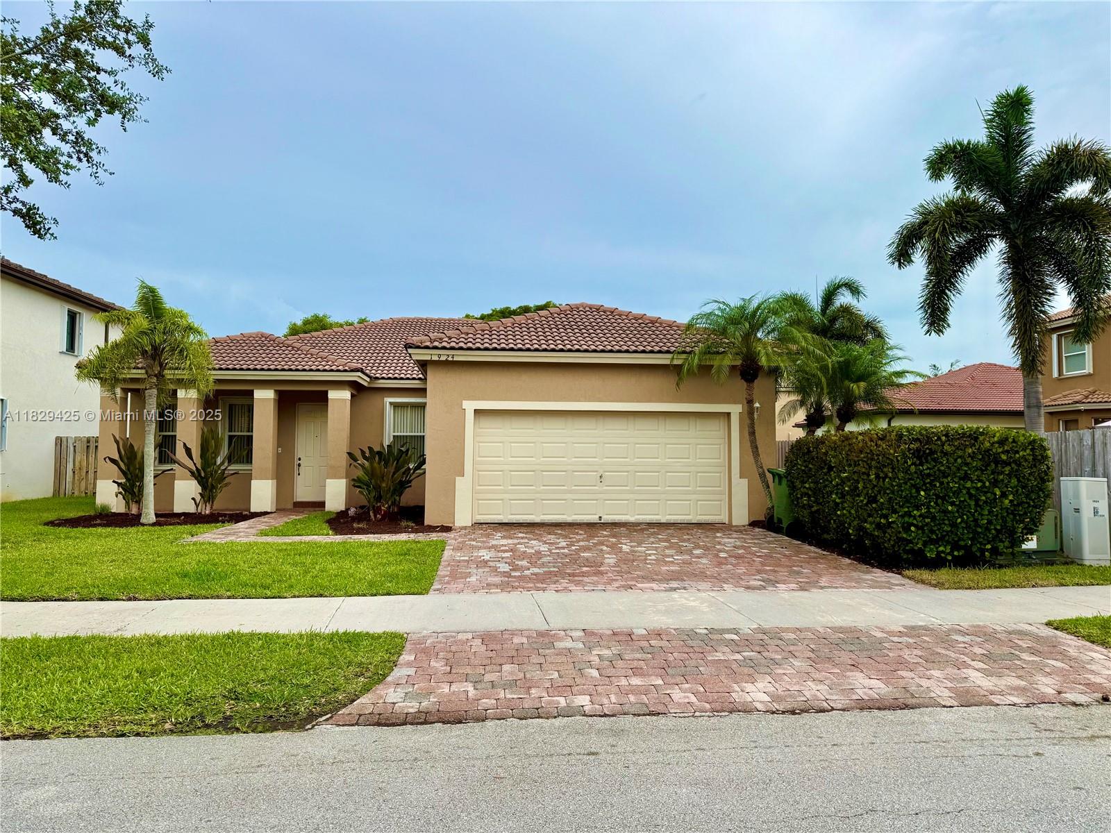 Welcome to this beautiful, maintained 3/2 home with a 2-car garage, located in the exclusive gated community of The Shores. This charming residence features a spacious open floor plan with tile flooring throughout, perfect for easy maintenance. Enjoy peace of mind with accordion shutters on all windows and doors. The rent includes direct TV, cable, high-speed internet, and alarm monitoring. You will enjoy 24-hr  gated security with roving patrols, Access to the community tennis center, and well-maintained surroundings ideal for relaxed, upscale living. Application requirement: Please submit the following: Recent pay stubs, credit report with score, photo ID, rental application, and contract to lease.