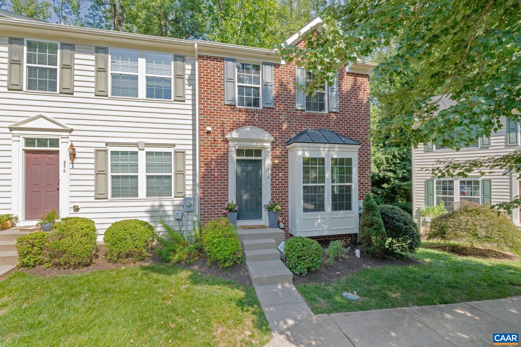 Excellent value for this spacious, turnkey brick end unit in a prime City location. Perfect for UVA medical professionals, investors, or house-hackers! Under a mile to UVA Medical Center, with a bus stop 0.3 miles away and Forest Hills Park & Splash Pad just 0.4 miles via the City trail. This former model home shines with upgrades and extra space throughout, plus a private patio and deck backing to wooded green space! Enjoy easy main-level entry. There you are greeted by newly refinished oak hardwoods gleaming across the main level, where large windows and natural light create a true treehouse feel. The kitchen features granite counters, stainless steel appliances (including a newer dishwasher), and an island. Upstairs, the owner’s suite boasts vaulted ceilings, a walk-in closet, and an en suite bath with floor-to-ceiling tile. The finished, walk-out basement includes a full bath, exterior entrance, and flexible space—perfect for a guest or in-law suite setup! Reserved parking, plus guest and street parking. HOA covers exterior maintenance, trash, and more. 1-year home warranty included for peace of mind!