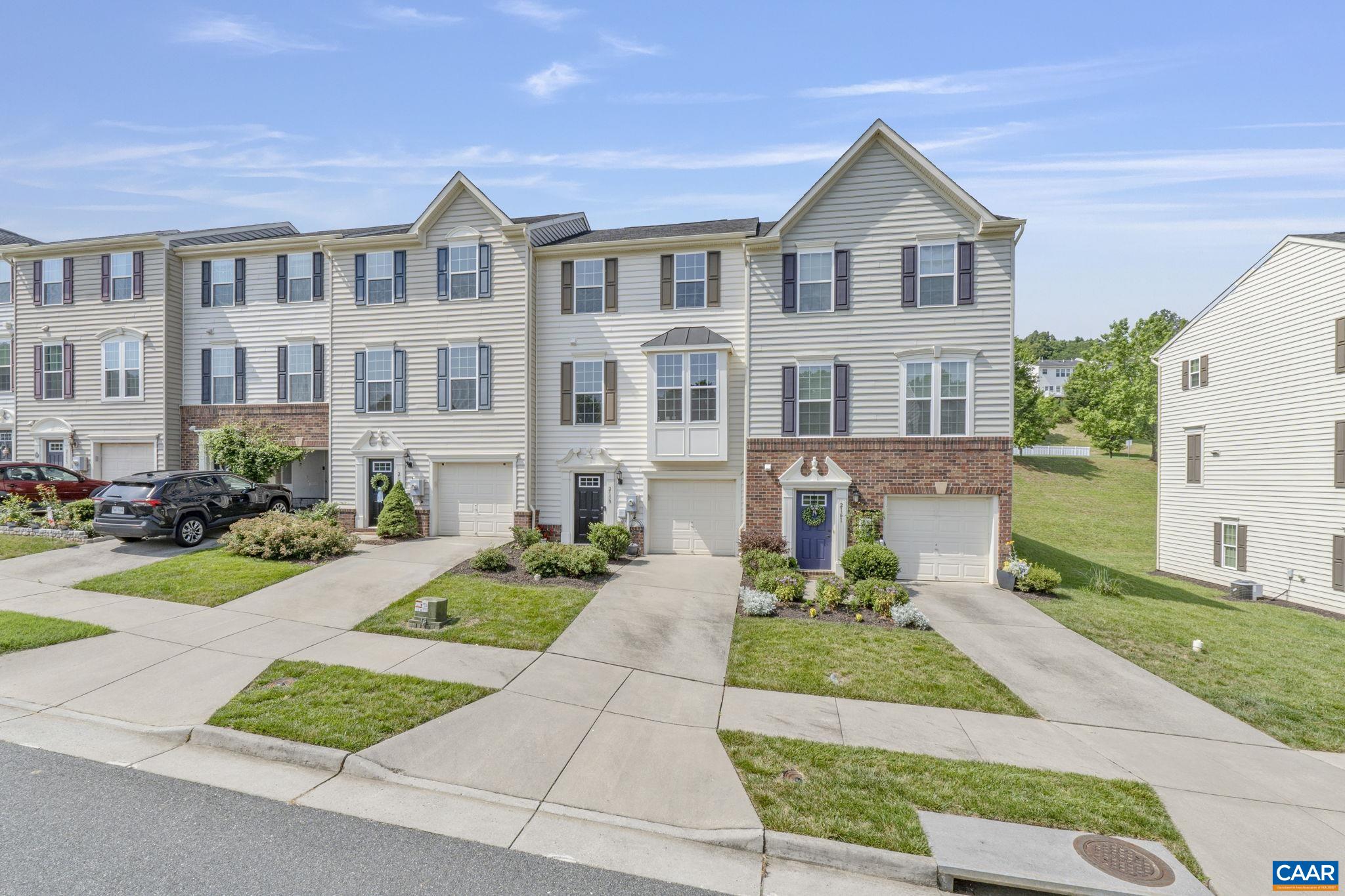 Ready to Invest or Move-In! This Pavilions at Pantops townhome has Blue Ridge Mountain VIEWS, a one car GARAGE and a rare 4th bedroom. Enjoy the open main level floor plan with a large, well appointed kitchen, spacious dining area, 1/2 bath and custom living room details like a stunning accent wall & plantation shutters. The kitchen features GRANITE countertops, STAINLESS appliances, breakfast bar, an ISLAND and PANTRY. Don't miss the NEW composite DECK and fenced back yard, perfect for entertaining, relaxing or pets. Upstairs you will find more beautiful WOOD FLOORING in the generous primary suite with ensuite bath & walk-in closet. Two additional bedrooms, a full hall bath, and convenient laundry finish out the top floor of this desirable floor plan. The entry level includes a 4th bedroom with 2 large closets and a 3rd full bathroom. Convenient to Darden Towe Par, Downtown Charlottesville, UVA, and Sentara Hospital with easy access to Pantops shopping and I-64. This home is a must see and at a great price!
