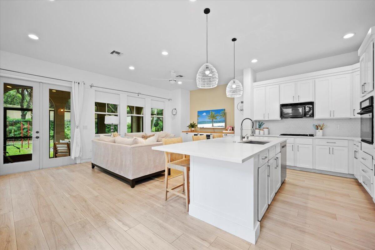 Magnificent & Fully Renovated 3Bed/2.5Bath Home. Discover this Stunning Home Featuring a Gated Courtyard Entrance. The Open Modern Kitchen is Equipped with Top-Notch Appliances, Exquisite Quartzite Counters, Tile Backsplash & Refurbished Cabinets. Enjoy Separate Sun-Lit Living & Dining Rooms, Perfect for Entertaining. The Oversized Owner's Suite Offers Preserve Views + Access to a Private Screened-In Balcony. Spacious 2nd & 3rd Bedrooms have Ample Closet Space. Outdoor Living is a Dream with an Extended Screened-In Patio + a Large Backyard. Spa-Like Bathrooms, New AC Units & Water Heater as well as Luxury Vinyl & Engineered Plank Wood Floors Throughout. Evergrene has Resort-Like Amenities, Minutes to the Beach, Golf/Tennis Facilities, Restaurants, Shops & Airport, ''A'' Rated Schools.