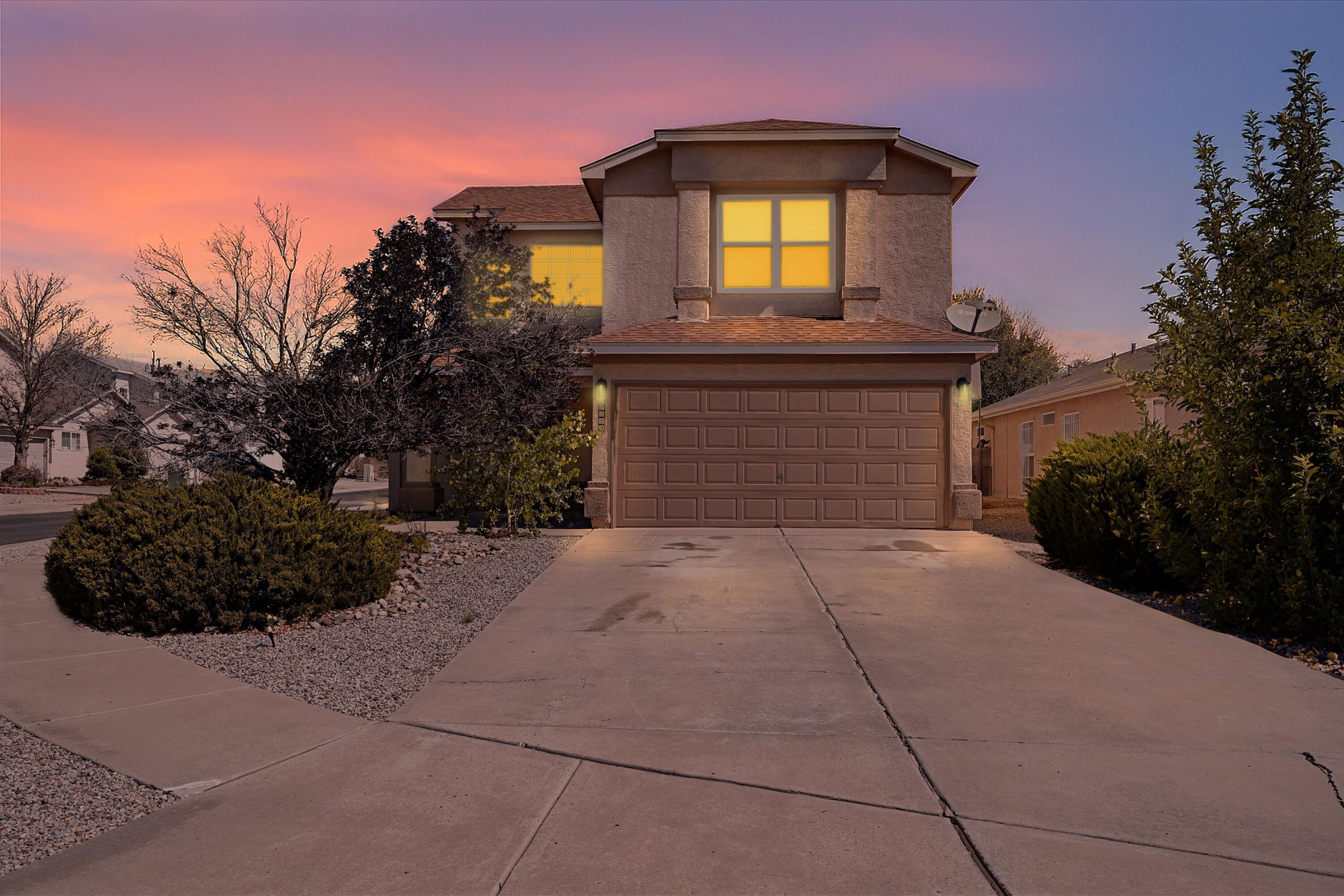 WELCOME TO A GATED SOUTHWEST GEM WHERE STYLE MEETS FUNCTION ON A PRIME CORNER LOT. Step into the light-filled living area where a cozy corner fireplace sets the tone for relaxed evenings. Color accent walls add personality, while the open layout flows easily into a sleek kitchen and spacious dining area. Upstairs, a flexible loft offers room to play, work, or unwind. The primary suite features a walk-in closet and a peaceful retreat. Enjoy morning coffee or evening gatherings in the walled backyard with an open patio and storage. Close to I-40, shopping, and schools. Schedule your showing today!