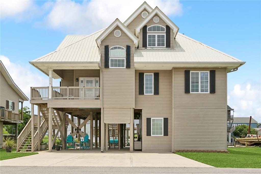 WATERFRONT LIVING AT IT'S BEST!!! This beautiful home features 3 bedrooms and 2.1 baths and 2387 ttl sq feet. Open and flowing floorplan features a massive den and built in bookcases. Every room has waterfront views. Kitchen has beautiful 42 inch white cabinets, granite counters, gas range, and stainless appliances. Dining area has lovely plantation shutters and can accommodate a large group for gatherings. Primary bedroom has a deck which is great to enjoy the morning breeze and just relax. The bottom level is wonderful for entertaining having crawfish boils or crab boils. In minutes you can be in your boat and in Lake Pontchartrain. Louisiana's sportsman paradise! Cargo lift is convenient for carrying groceries. A boat house and lift waiting for your boat. You can wave to your friends and neighbors as they pass in their boats. This area of Slidell is a great place to call Home. Call today for a private showing!!!