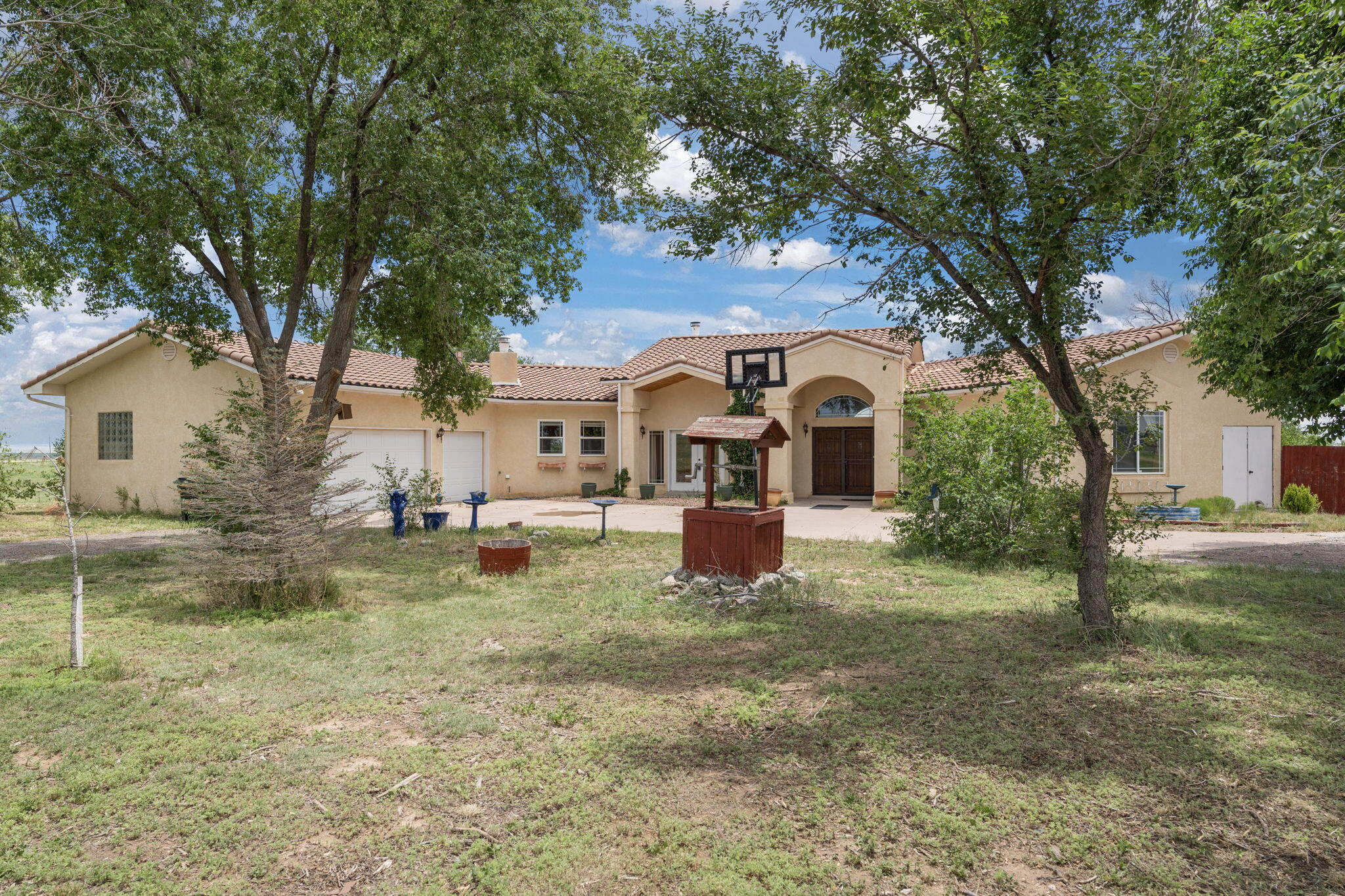Welcome to where the sunrise stretches over open pastures and your horses greet the day just outside your window. This exceptional 10-acre property is designed for equestrian living. Complete with well-maintained horse stalls, ample space for riding.Step inside the home, where natural light fills every room, echoing the warmth and serenity of the land. The open layout creates a seamless connection between indoor comfort and the outdoor beauty. Imagine sipping your morning coffee as your horses graze peacefully nearby, or unwinding on the back porch as the golden hour settles across the fields. Here, you're not just buying a home you're embracing a lifestyle. One with space to breathe, a place to ride, and the quiet joy of country living. Come experience the dream you've be waiting for!