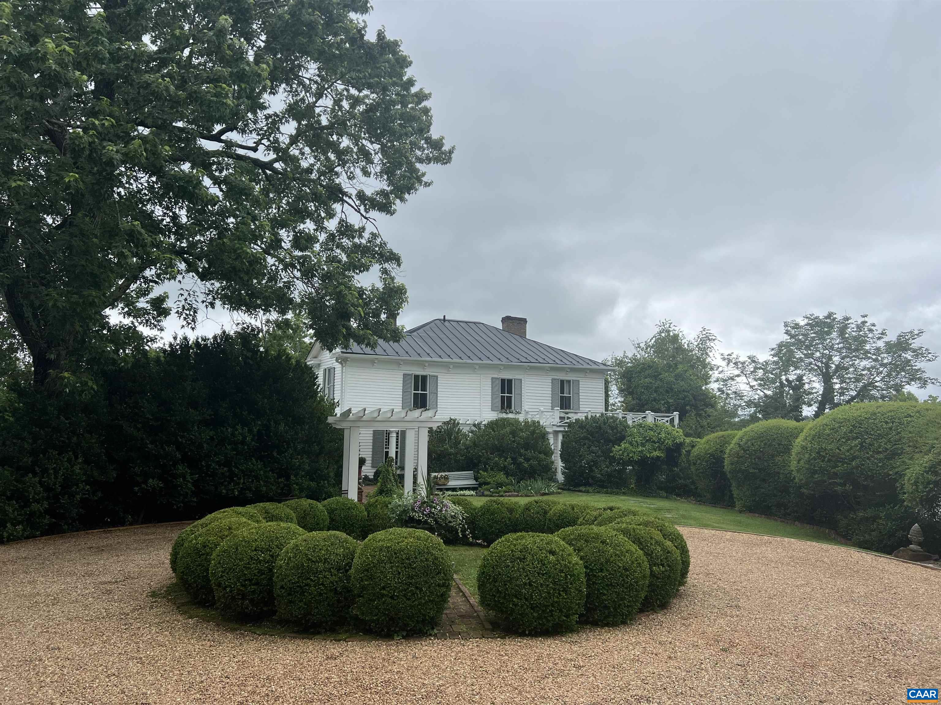History. Authenticity. Charm. Hatton is a circa 1880 iconic Albemarle County estate set on 13.9 peaceful acres with frontage on the James River...Lovingly & gently restored over the past 20 years, the gorgeous heart pine floors, original moldings, woodwork, plaster walls, mantles & staircases have retained their classic simplicity & beauty...Light pours in though the banks of windows that open to beautiful vistas. A double staircase leads from the front center hall to the open second floor landing. The 500 sq.ft. wrap-around porch provides airy additional living areas as well as sweeping views.  Grounds consist of extensive gardens, walkways and allees: more than 70 boxwoods, many originate w/the house, numerous perennials as well as hardscapes of flagstone, brick & soapstone. In addition are several significant renovated outbuildings: a charming, rustic one bedroom guest cottage w/kitchenette, living room, bath & laundry, a cute gardener's shed & a recently completed writer's studio. A sizable barn/boathouse would adapt to a variety of uses; Easy access to water activities. 19 miles to Charlottesville...Private & secluded, yet not isolated...DO NOT TRY TO SEE THIS PROPERTY WITHOUT AN APPOINTMENT...ACCESS IS THROUGH A FARM...
