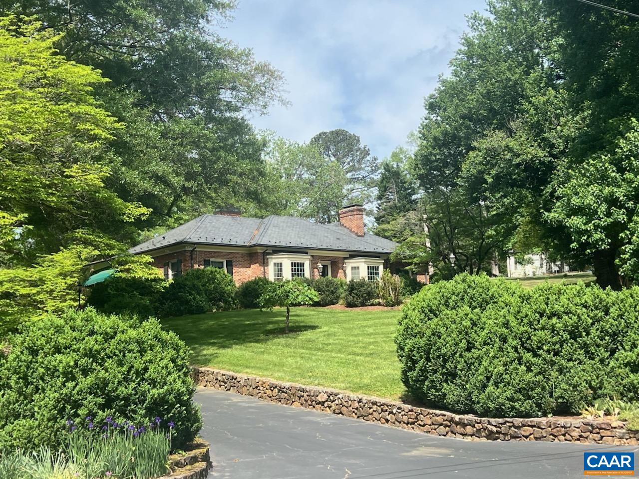 A remarkable property in Bellair.... Set on a 1.9 acre beautifully landscaped, elevated lot...Magnificent trees and grounds...Gracious and comfortable....Unique and gracious floor plan ...Living room(w/FP) and dining rooms with floor to ceiling walk-in bay windows, family room with fireplace opens, to the bright sunroom overlooking the stunning pool setting...Many custom features: copper gutters, slate roof, 2 sunrooms, circular driveway to the front entrance, lower driveway to the terrace level...Full terrace level with french doors open the family room has built-in bookcases, masonry fireplace, huge wet bar, room for a pool table, wide corridor to study, laundry room and playroom...