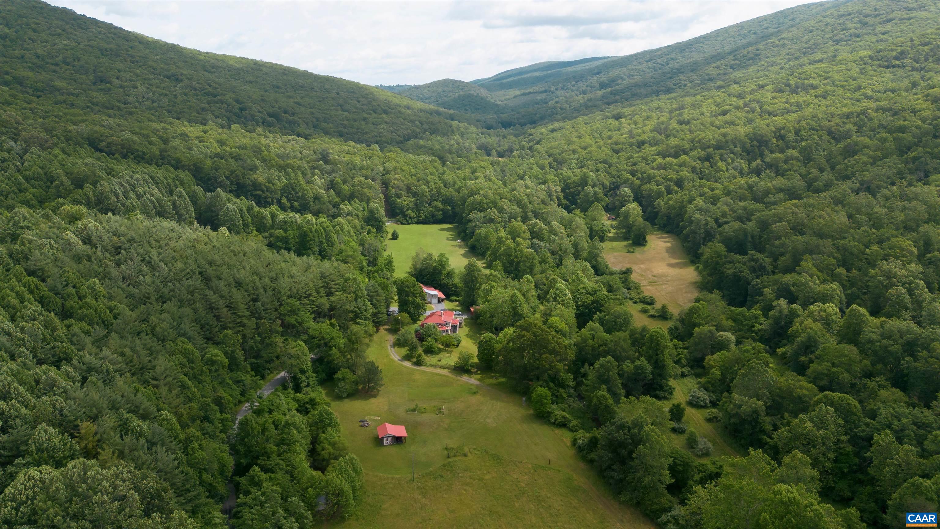 Welcome to Bath County with the second lowest population per square mile in all of Virginia. Here is the ultimate country getaway with 79.81 acres in a pristine valley surrounded by the George Washington National forest  and 2000 feet of frontage on a lively trout stream passing right beneath the existing home. Journey's End offers a perfect setting for a family compound with a charming 1936 residence and outbuildings and multiple building sites with magnificent views in all directions. The property has already been divided into two parcels with an approved septic site on a private building site. The property has about fifteen acres of level, open land ideal for horses or farming along Dry Run. The balance is in mixed woodland that rises up to the national forest. There is a nice trail network throughout for hiking, hunting, ATVs or horseback riding. Fisherman will enjoy Dry Run, at 2041 feet in elevation creating a classic, cold water brook trout stream that passes through the entire property.  Take off your watch and experience this wonderful property in Bath County. If you wish life was like it used to be.. It still is at Journey's End.  For more information on the residence at Journey's End see MLS 666061
