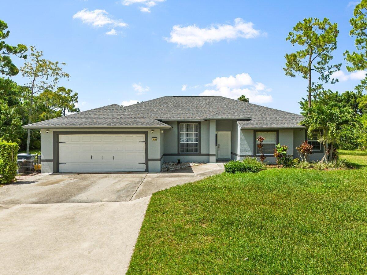 Welcome to this beautifully updated 4-bedroom, 2-bathroom home nestled in the peaceful community of Loxahatchee! Situated on 1.14 acres, this expansive home features modern comforts, offering the perfect blend of functionality and Florida lifestyle. Upgrades include New Roof (2024), Tankless Water Heater, AC (2021), Wood-look Tile Floors, Impact Windows, Reverse Osmosis System, Surround Sound, Full Camera System, expanded primary suite with newly added sq footage and oversized closet, and so much more! The lot is fully fenced with mature landscaping, fruit trees, a gazebo, and a fire pit, offering a true outdoor oasis! Additional bonus space in shed is equipped with power and A/C, great for hobbies or extra storage. Conveniently located near Publix and shopping-