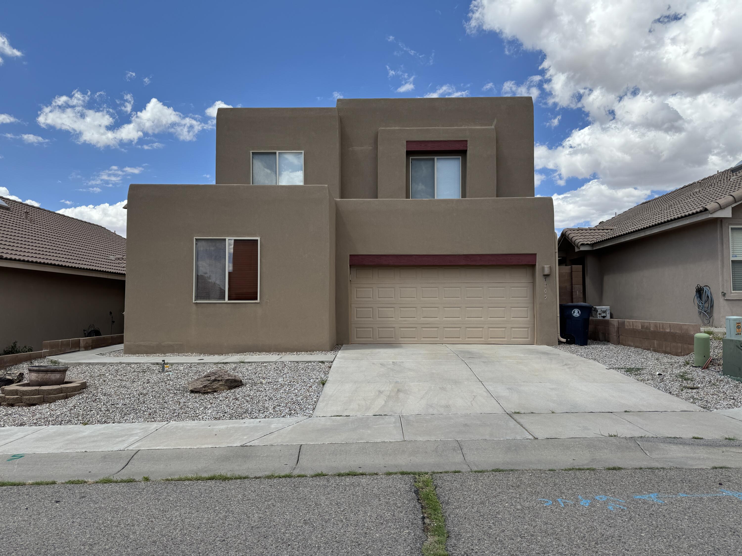 This beautiful residence features a spacious master bedroom and bath on the first floor, complete with an oversized master closet. Enjoy the charm of vigas, wood accents, and custom wood blinds throughout the first floor. The gourmet kitchen is equipped with stainless steel appliances, granite countertops, and a travertine backsplash.With 4 bedrooms, 4 baths, a comfortable living room featuring downstairs and upstairs kiva fireplaces, and a large upstairs loft, this home is perfect for a growing family. Situated just one block from La Cueva High School and within the boundaries of the highly sought-after La Cueva, Desert Ridge, and Northstar schools, this home offers easy access to I-25. Don't miss out--schedule a viewing today