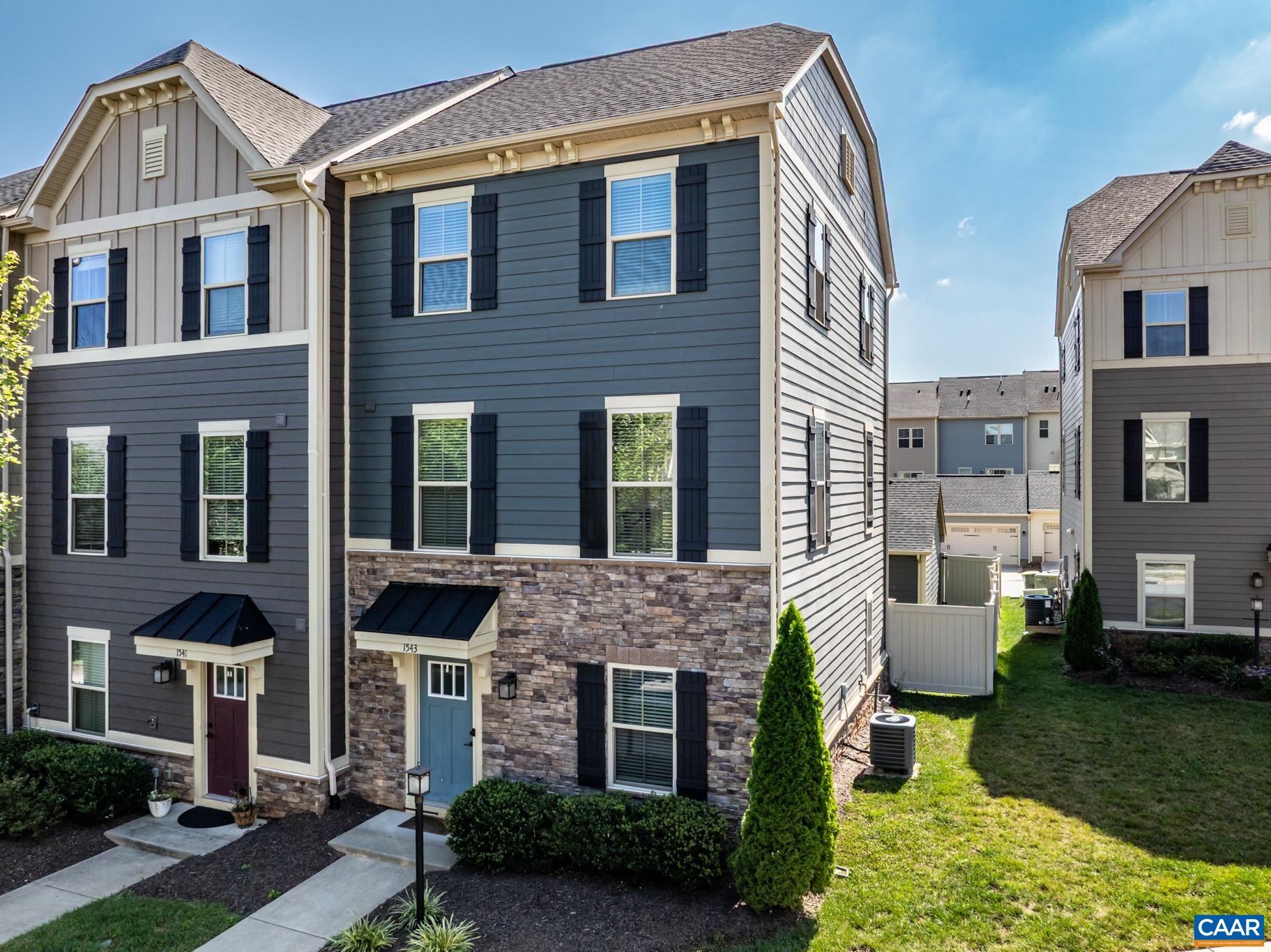 END UNIT! This luxury townhome offers upscale living with a light-filled open floor plan, featuring 3 bedrooms, 2 full baths, and 2 half baths. The finished lower level includes a spacious rec room and study/library with a half bath, opening to a private fenced courtyard and 2-car detached garage. Interior highlights include upgraded cabinetry, granite countertops, stainless steel appliances, Nest thermostat, shiplap accents in the office, new carpet, and dual shower heads in the primary bathroom. A spacious backyard completes this exceptional home!