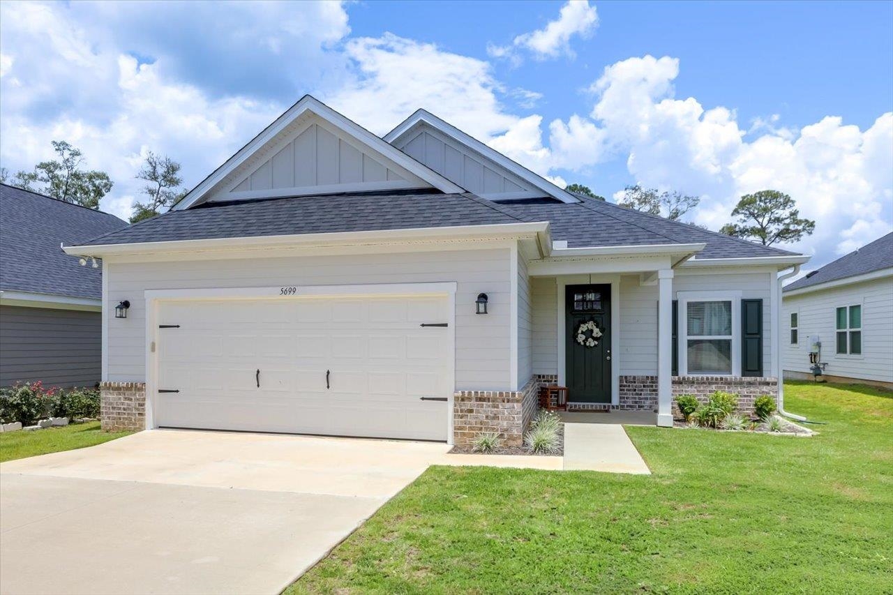 Elegant and Immaculate Like-New Home.  HUGE kitchen with soft close cabinets and bar seating.  Open floorplan with soaring double tray ceilings.  Recessed lighting in kitchen and living areas.  Primary Bedroom with oversized walk-in closet and bathroom suite with double sinks are separate from the other two bedrooms.  LVP flooring in main living area. Rare find is the private back patio and yard.  No neighbors in your back yard!  Large double car garage.  Indoor laundry room.  HOA cuts your grass.  Just 5 minutes from Publix/CVS/DG, Fred George Park and J. Lee Vause park/dog park and 2 additional landings for Lake Jackson. Please see video for a view of these great ammenties.