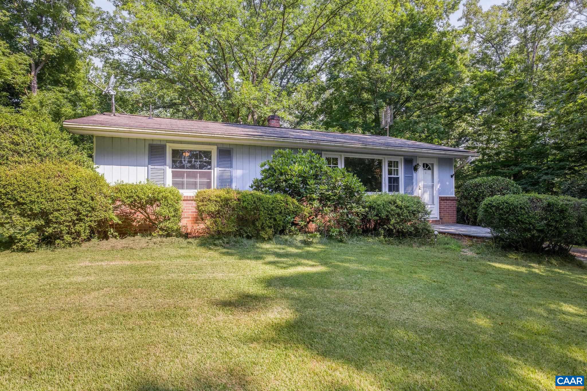 Nestled on 3 private acres, this classic 1960s brick Ranch offers the ideal layout for gardening enthusiasts, hobbyists, or anyone seeking peace and privacy. While the home is ready for updates and improvements, it boasts potential with a spacious, partially finished basement that's perfect for expanding your living space or creating a custom workshop. Outside, you will find three sheds, including a sunlit garden shed with large windows that invite in natural light, great for potting plants or another workspace. The property is already equipped with a generator hookup and includes a brand-new water heater.