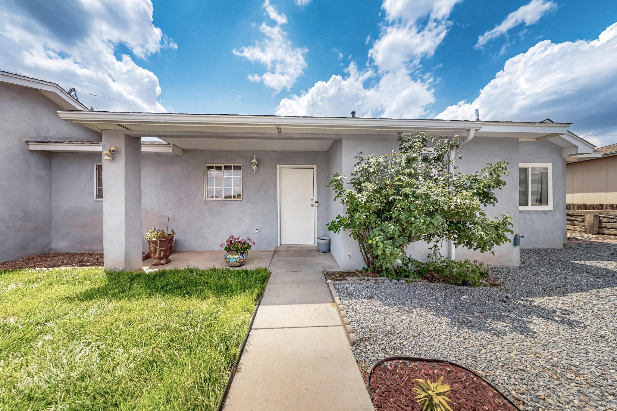NEW PRICE IMPROVEMENT!! Welcome to this beautifully maintained 3 bedroom, 2 bathroom home nestled on .29AC lot, perfect for comfortable living & outdoor enjoyment. Step inside to find a bright and inviting interior featuring laminate wood flooring throughout & an open-concept living space ideal for entertaining.The updated kitchen is equipped with newer SS appliances and great bar offering both style and functionality for the home chef. Natural light pours in, creating a warm and cheerful atmosphere in every room. Enjoy the convenience of a 2car garage & the added bonus of backyard access ideal for RV parking, gardening, pool or future expansion. With plenty of space both inside and out, this property is a rare find that combines modern updates with room to grow.