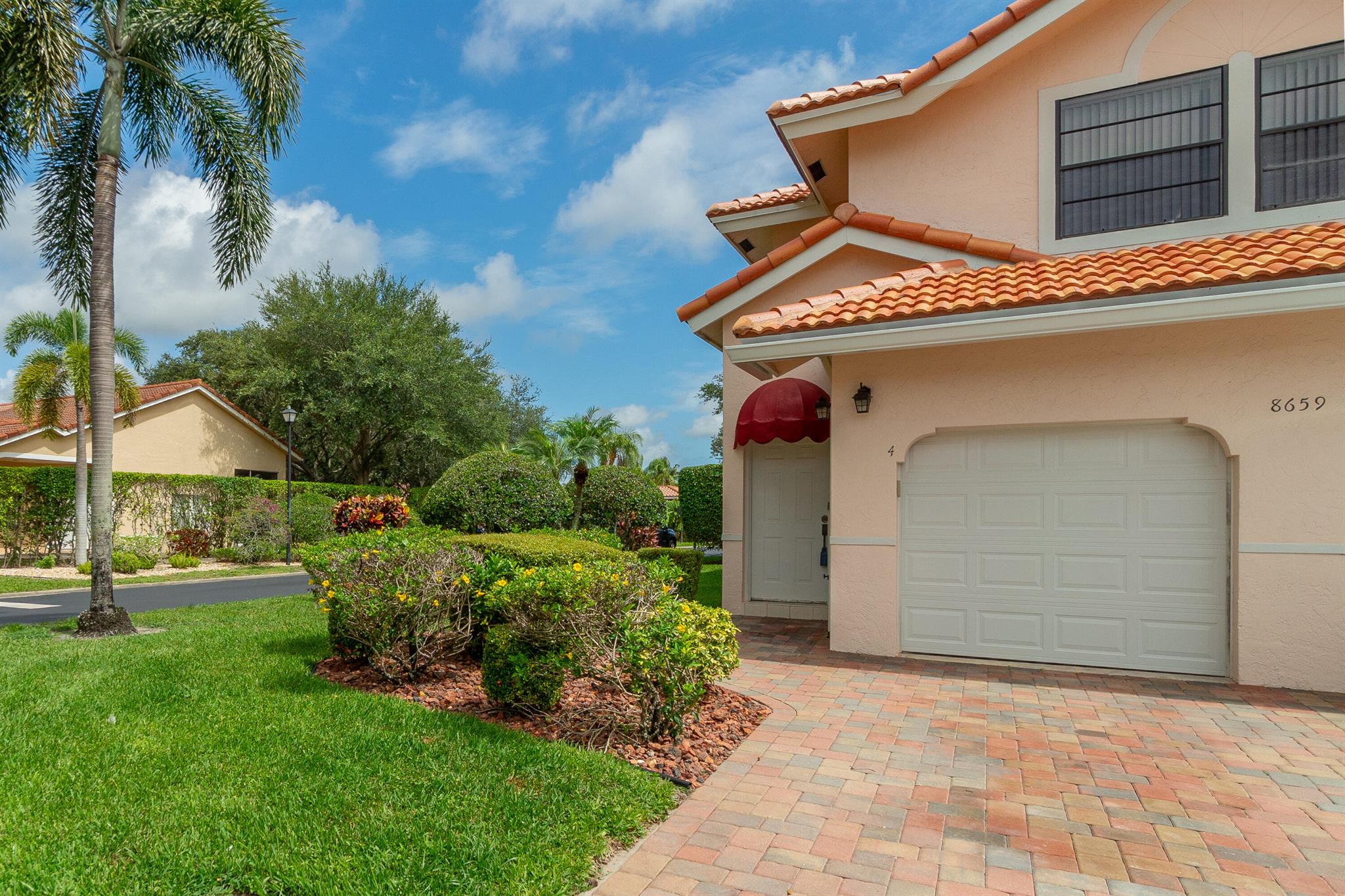Rarely available 3 bedroom 2 bath 1 car garage corner unit located in the all age community of Villa San Remo. This corner unit location allows in natural light to the main interior of unit and private oversized screened balcony. Monthly fees include use of clubhouse, community pool, tennis/pickle ball & basketball courts, fitness center & also include insurance for exterior of building, roof maintenance, cable, internet, painting, lawncare, tree trimming & 24 hour manned guard gate. Pet friendly community in close proximity to great schools, shopping & dining.