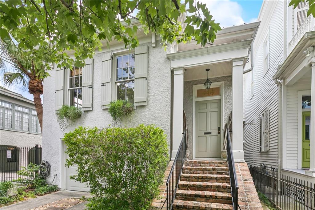 This spectacular home is made for entertaining. The property boasts 3 living areas and a 1 car garage!  There is a familiar double living and dining room area with the Primary BR upstairs, a modern sunken den downstairs that has a kitchenette and opens to the backyard Grotto Pool and bar area.  What a fantastic set up for outdoor entertaining. Located 2 blocks off St Charles Avenue and 1/2 BK off Napoleon Avenue. Perfect Mardi Gras Parade house and also easy to walk to 10+ restaurants, bars and cafes! The location is premier and lives large!