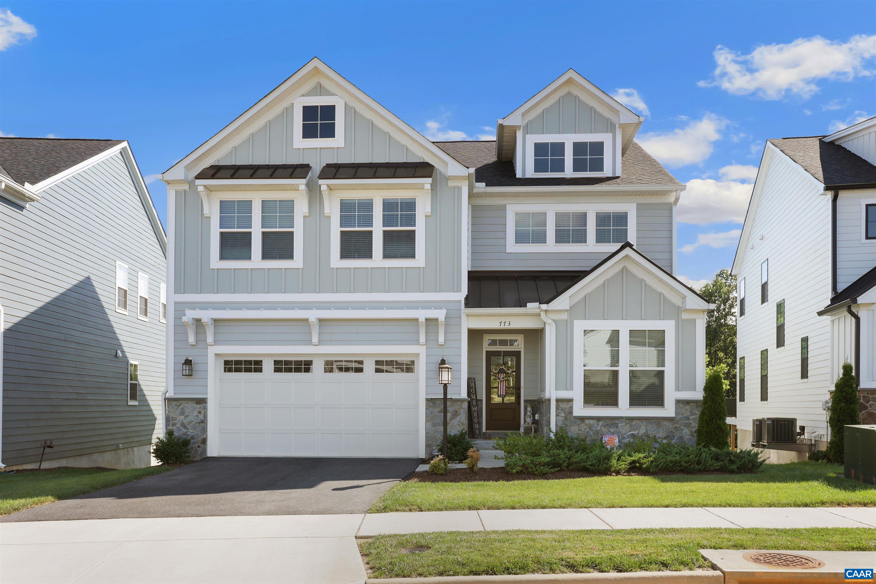 Stunning 4-Bedroom, 3.5-Bath Home in Sought-After Crozet, VA!  Built in 2022, this beautifully maintained home feels fresh and like new, with abundant natural light and modern design throughout. The open-concept main level features elegant LVP flooring, a spacious living room with a double sided fireplace, and a gourmet kitchen with an eat-in island, walk-in pantry, and dining area that opens to a screened porch overlooking the lush, green backyard.  Upstairs, you'll find a versatile two-story loft and four generously sized bedrooms with soft, plush carpeting. The luxurious primary suite includes a spa-like en-suite bathroom with dual vanities, an oversized tile shower, modern finishes, and direct access to the laundry room for ultimate convenience.  Quality construction and energy-efficient features include 2x6 exterior walls, R-21 insulation, energy-efficient windows, wood shelving, a tankless water heater, and high-efficiency HVAC.   The lower level offers endless potential—ready for your finishing touches and already features a finished bathroom. The plush green yard is tree lined for privacy, and has access to trails perfect for the outdoor enthusiast.  Located close to ACAC fitness center & Claudius Crozet park which feature