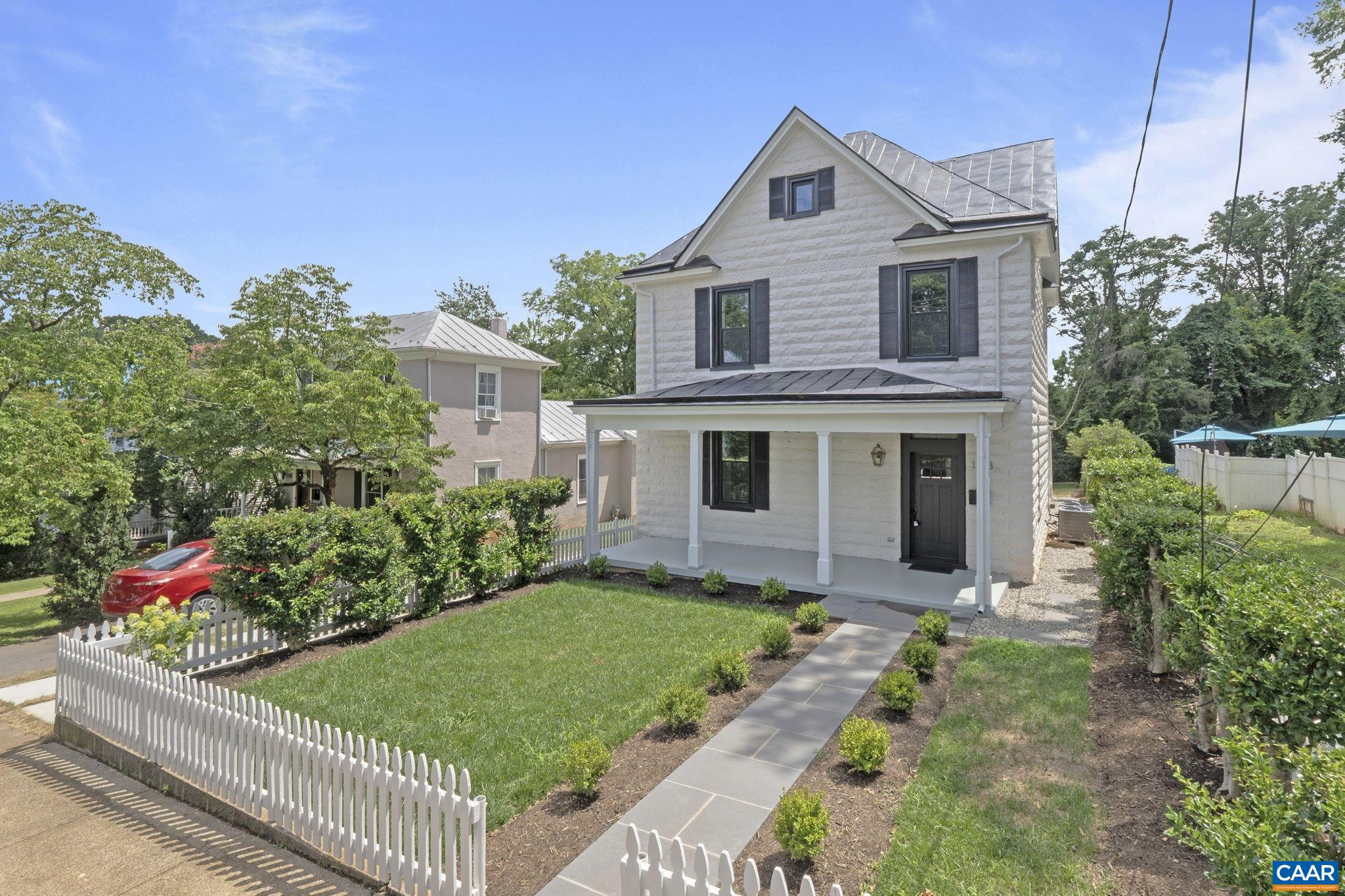Exceptional renovation of a classic city residence with attention to detail and elegant, timeless finishes.  The home was taken down to the studs and rebuilt, tailored to today's lifestyle.  Highlights of the home include: 10 ft ceilings on the main level, 9 ft ceilings on the second level, gleaming hardwood floors, upgraded trim and moldings throughout, premium Pella windows, recessed lighting, gas fireplace, and built in speakers accessed through blue tooth technology.   The spacious kitchen is the heart of the home with the large center island.  Quality finishes are found throughout this special space: abundant Kraftmaid Monclair maple cabinets, Brazilian Carrera Dolomite Natural Stone, Professional Gas Range with pot filler, and beautiful hardware.  A walk-in pantry and laundry room are located just off the kitchen and add to the function of the space.  All three bedrooms have ensuite baths.  The two larger baths have double sinks and Italian Marble finishes.  Enjoy city living on the front porch or back deck that overlooks the flat rear yard.  2 story unfinished dependency adds to the appeal of this special property.   A short walk to Downtown and surrounding areas!