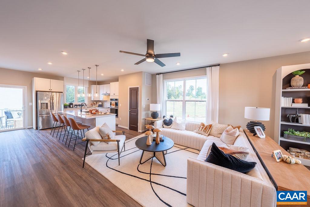 Act Fast — This modern interior Kenridge townhome in the Charming Farmhouse Collection is available for July/August move-in! With 2,154 sq. ft. of thoughtfully designed space, it features 4 bedrooms, 3.5 baths, and a 2-car garage. The open-concept layout includes luxury vinyl plank flooring, a gourmet kitchen with  Maple Winstead White cabinets, Desert Silver Silestone countertops, and stainless steel appliances. Enjoy outdoor living with a spacious rear deck—perfect for relaxing or entertaining. Schedule your private tour today—this opportunity won’t last!