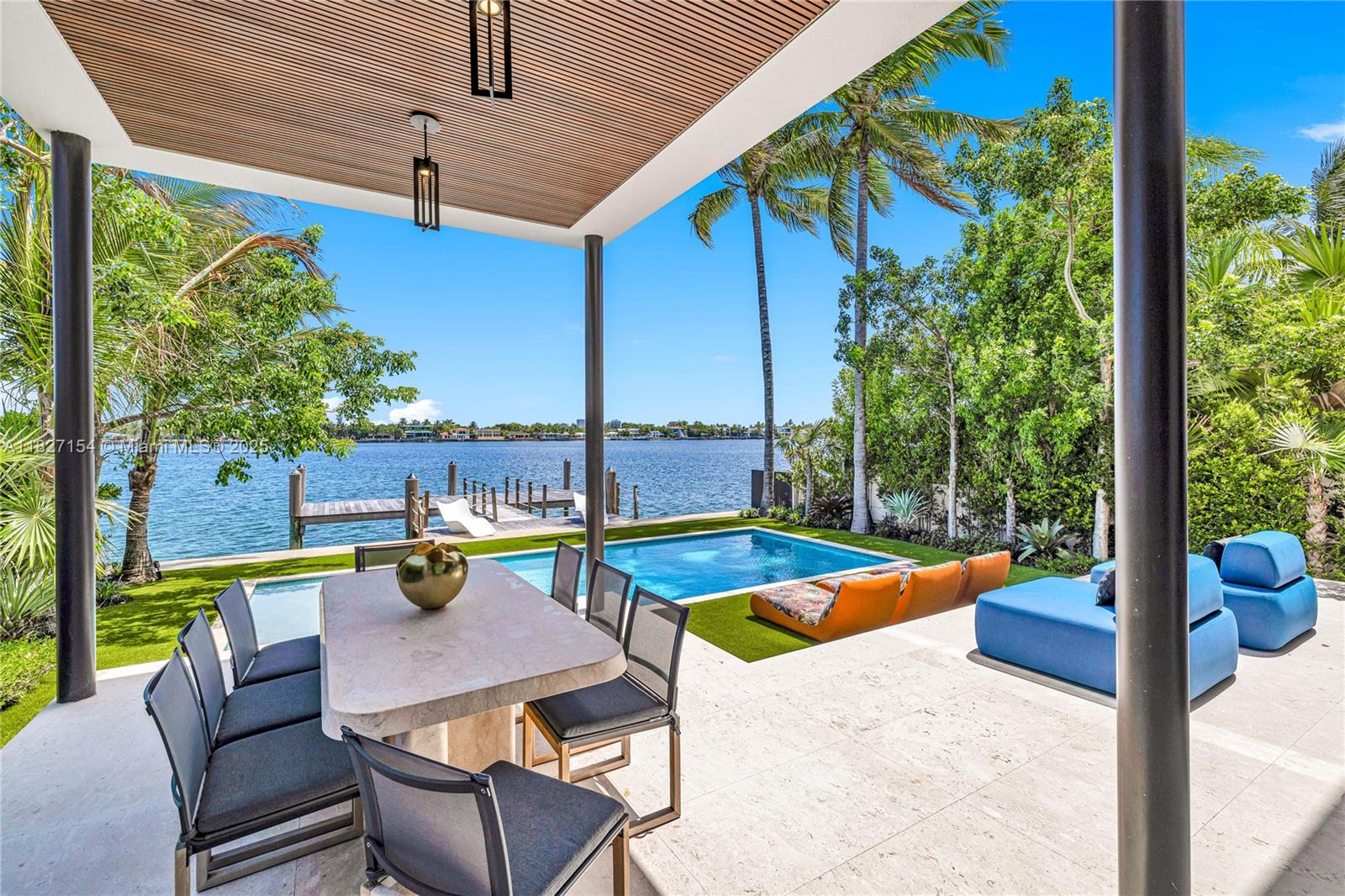 Experience luxury waterfront living in Miami Beach. This recently built modern home offers breathtaking Biscayne Bay views, spectacular sunsets, and 50 feet of waterfrontage with no fixed bridges to the ocean. Featuring 4 spacious bedrooms and 4.5 bathrooms, it spans nearly 4,000 sqft under A/C, plus a climate-controlled garage that can accommodate a car lift, and a boat dock.
Designed with sleek modern architecture and meticulous attention to detail, the home includes a fully integrated Savant smart home control system, mosquito misting system, and premium finishes throughout. Located in a gated community, within walking distance to the beach and close to top-rated schools, this residence offers the perfect blend of luxury, comfort, and convenience.