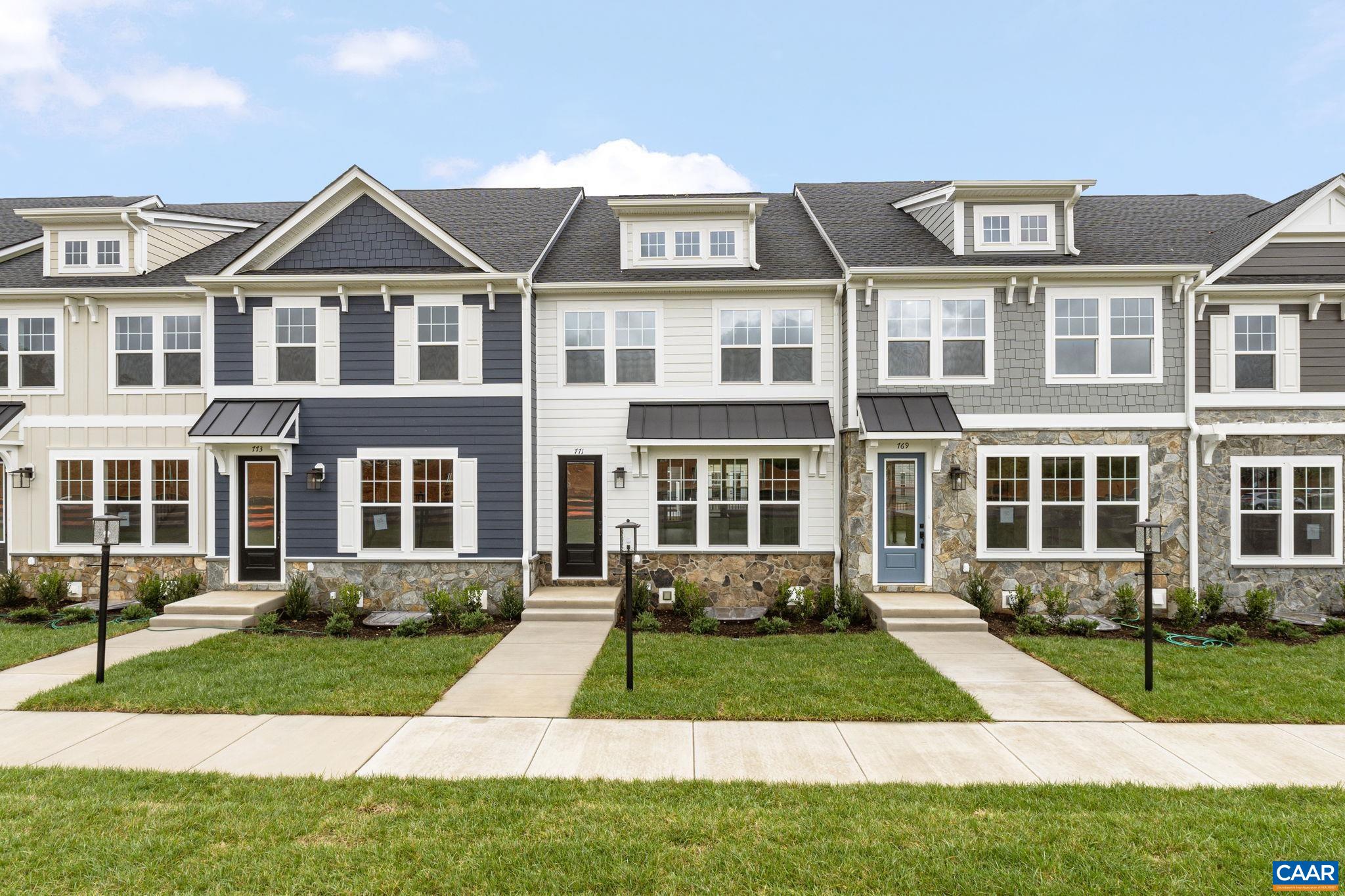 Now selling for August 2025 move-in. The Dogwood townhome at Dunlora Park offers a well-planned layout just minutes from Downtown Charlottesville. Step inside from the front entrance and you'll find a bright, open main level with a comfortable living area, roomy kitchen, dining space, and a walk-in pantry. A half bath and low-maintenance deck round out the first floor, offering an easy spot to gather or relax. Downstairs, the attached two-car garage leads directly into a finished rec room. Upstairs, the second floor includes a spacious primary suite with private bath, two additional bedrooms, a full hall bath, and laundry area. Photos shown are of a similar home and may include optional features.