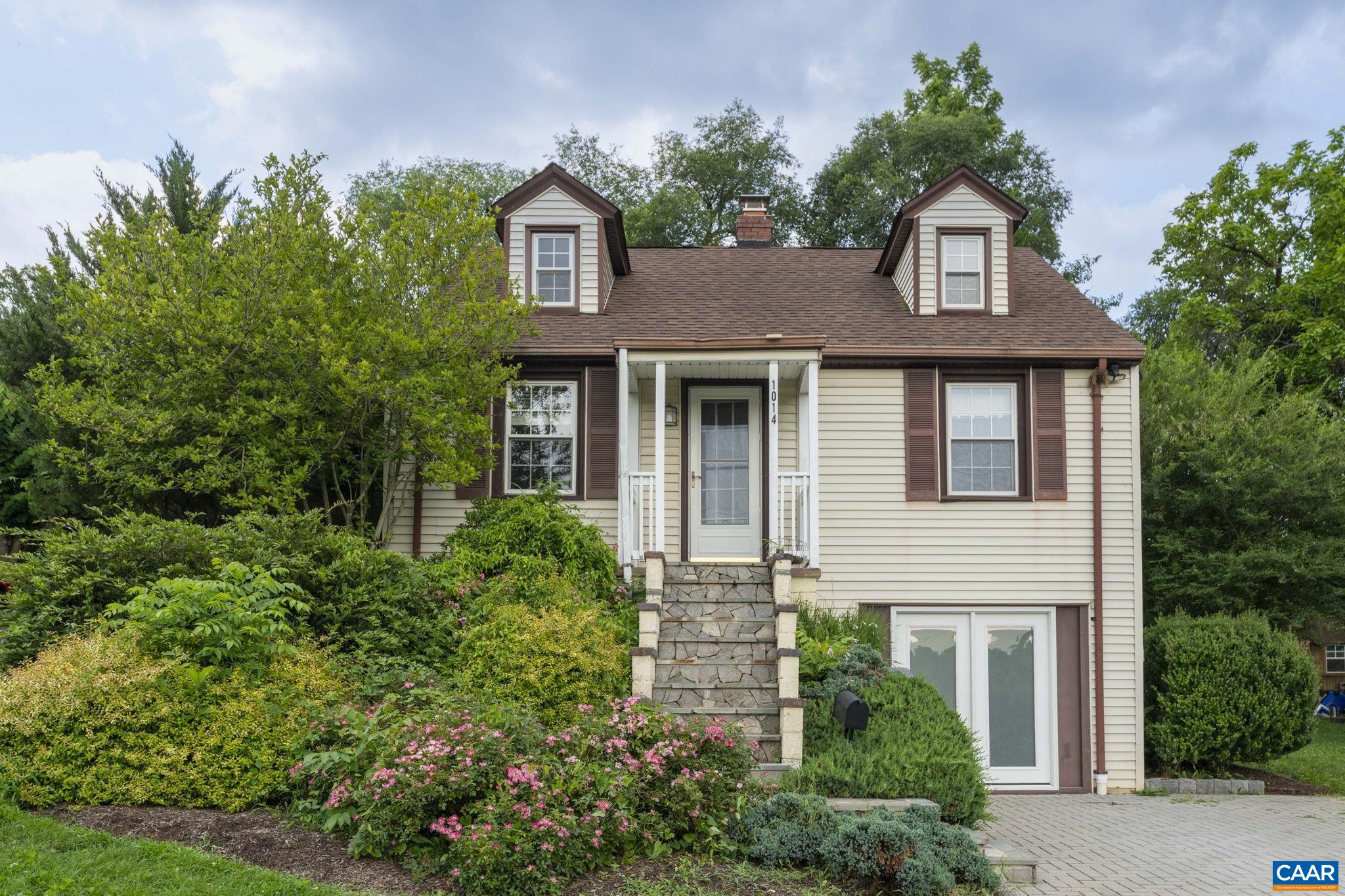 Charming Cape Cod in desirable Charlottesville location! This well-maintained home features beautiful hardwood floors throughout, updated kitchen with white cabinets & stainless dishwasher & microwave plus a stunning renovated bathroom with walk-in shower & modern finishes. The main level offers bright living spaces while the finished basement provides the primary bedroom, rec room perfect for office, washer, dryer, and plenty of storage. Outside, enjoy the private deck overlooking a spacious yard surrounded by mature trees. Stone steps and landscaping add curb appeal to this move-in ready gem. Convenient to UVA, downtown Charlottesville , and all Charlottesville amenities. Don't miss this opportunity! *and* terrace level was a highly profitable AirBnB for several years.