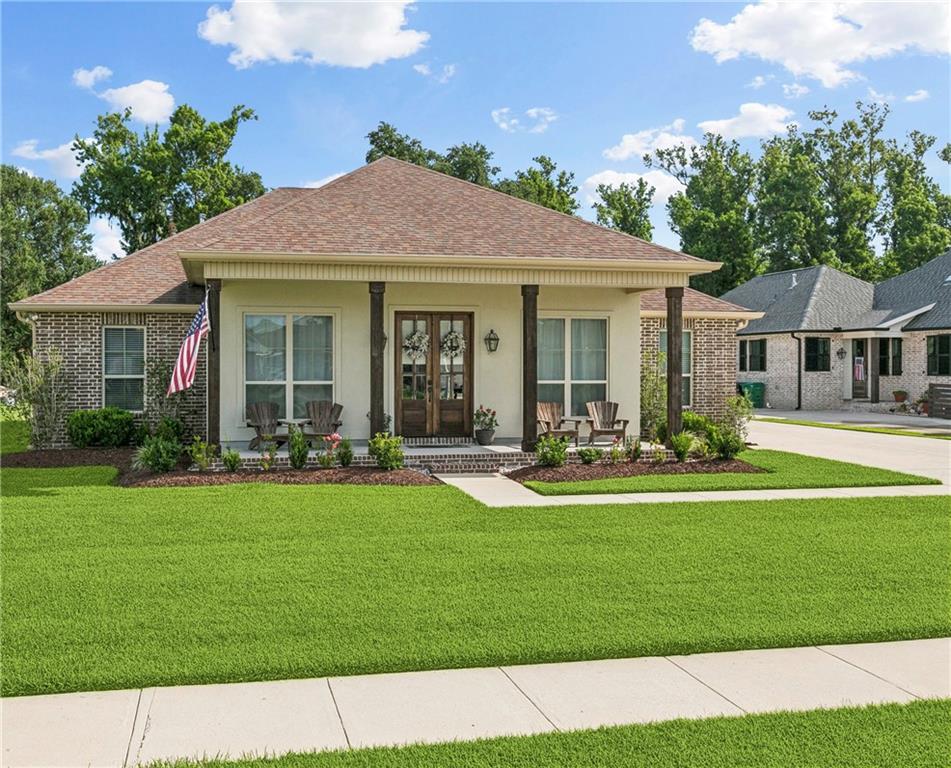 Welcome to this well-maintained 4-bedroom, 2.5-bath home offering over 2,200 sq ft of living space, located in a non-flood zone and only 8 years young! Step onto the charming front porch—perfect for your rocking chairs—and into a spacious, open layout designed for both comfort and functionality. Soaring 11-foot ceilings in the entryway, living room, and dining room create an airy, grand feel throughout the main living spaces. The home is completely carpet-free and features a beautiful kitchen with granite countertops, stainless steel appliances, and ample cabinetry—ideal for any home chef.
The inviting living room includes a gas/wood-burning fireplace and offers a peaceful view of the backyard with no rear neighbors. Outdoors, enjoy the expansive covered back porch, perfect for relaxing or entertaining.
A huge driveway with rear yard access leads to a 30 x 40 shop complete with electricity, a half bath, and a loft for additional storage—ideal for hobbies, a workshop, or home business use. This property also includes a whole house generator, a termite contract, and is located in an established neighborhood in St. Charles Parish, just minutes from local boat launches.
This home offers the space, features, and location you've been looking for—ready to welcome you home!