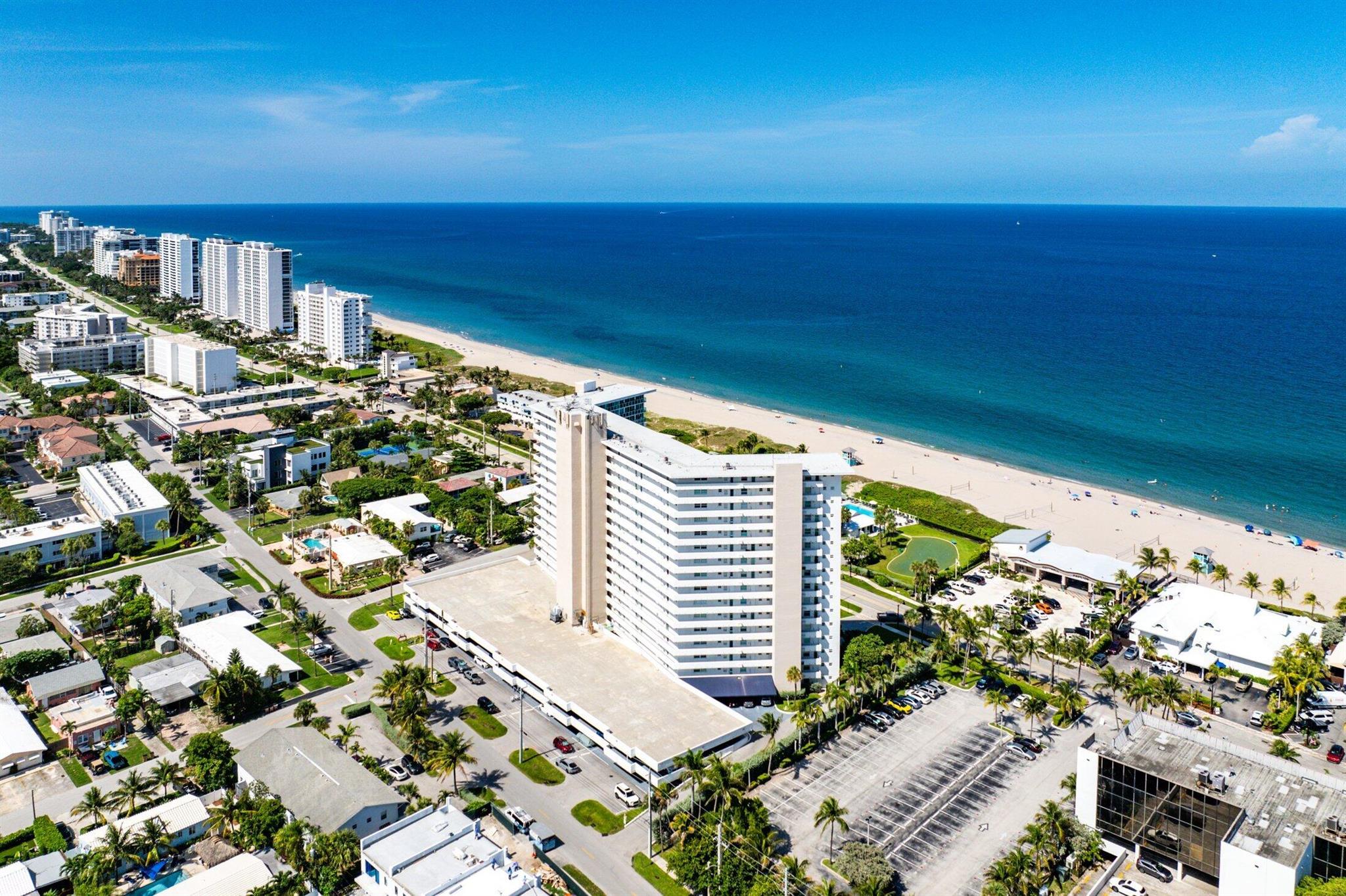 Discover your beachfront haven! This direct oceanfront condo provides breathtaking views at every turn. With 2 bedrooms and 2 bathrooms, the split floor plan is complemented by floor-to-ceiling hurricane impact windows. The kitchen is beautifully renovated, featuring quartz countertops and backsplash, as well as stainless steel appliances. The open layout creates a spacious living area, offering ocean views from every room. Gorgeous tile flooring extends throughout the space, and an expansive balcony invites you to enjoy your piece of paradise.Recent updates include a new AC unit (2023) and a tankless hot water heaterTake a short stroll across the street to JBs & Oceans 234. Celebrate at the newly renovated cabana and BBQ area. As an owner, you'll have access to all the Beach Club amenities, including a pool, golf putting green, shuffleboard, 24-hour concierge, and an on-site gym. Just steps away, explore the 976-ft Deerfield Beach International Fishing Pier, along with nearby shops and restaurants.