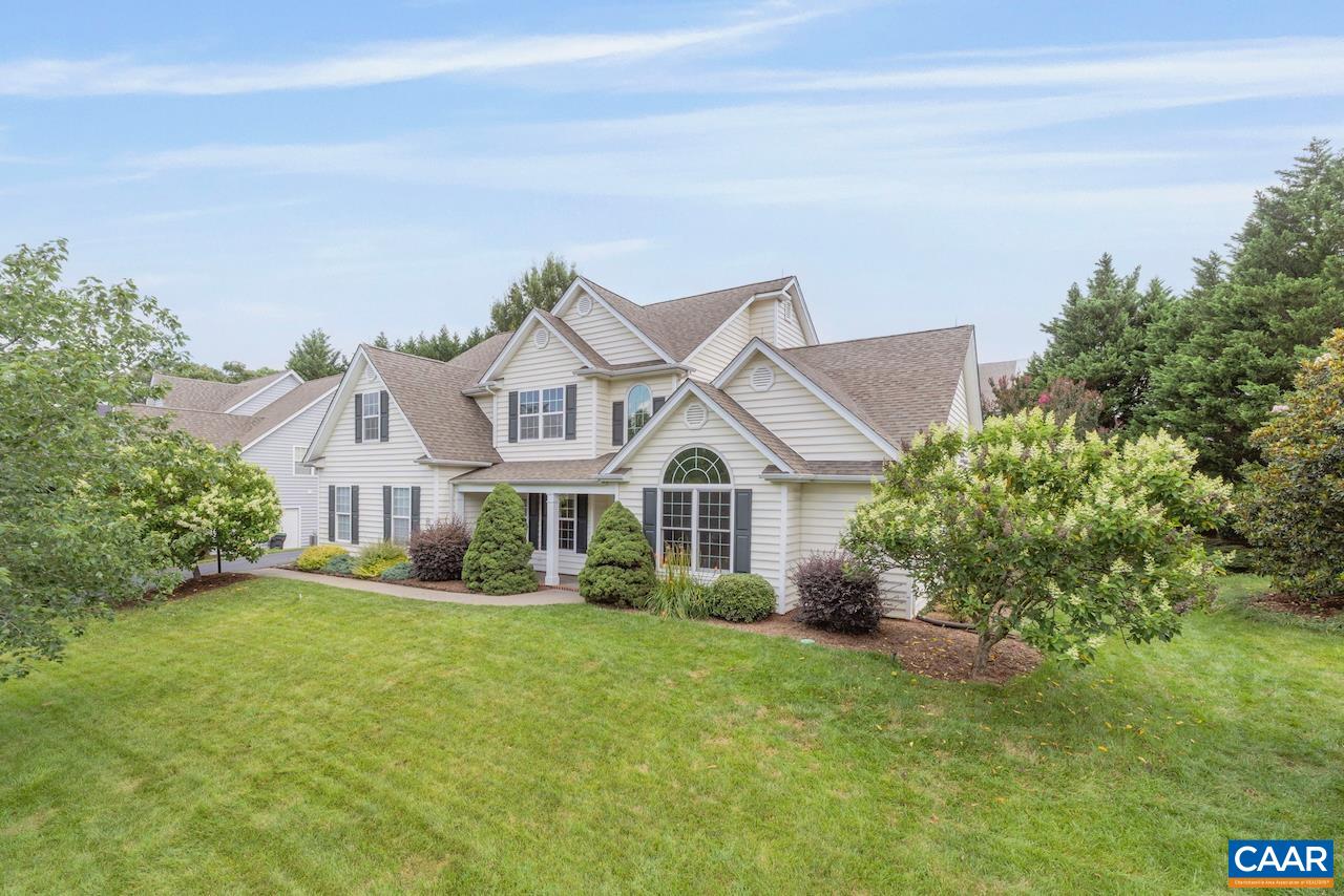 Open house Sunday 8/3 from 10:30 to 12:30. This charming Redfield home boasts a highly desirable open floor plan, featuring a convenient first-floor primary bedroom and a spacious home office for effortless single-level living. The impressive two-story great room, gleaming hardwood floors, and a large,  kitchen seamlessly overlook the professionally landscaped backyard. Upstairs, discover three generous additional bedrooms and a versatile loft thoughtfully open to the great room. The side-load two-car garage offers ample extra storage. Enjoy peace of mind with an invisible dog fence, efficient irrigation system, and pre-positioned lightning rods. Community amenities include a refreshing pool and engaging playground. Ideally located, it's just five minutes from UVA, 5th Street Shopping Center, and I-64.