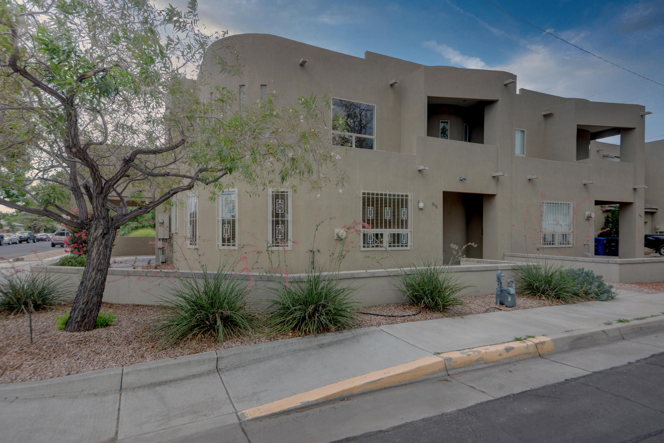 Downtown oasis, modern, and sleek home with tons of upgrades including refrigerated air, hardwood floors, and much more! This beautiful home has plenty of natural light with large open rooms and high ceilings. Master suite upstairs with tons of privacy, off suite office space, walk in closet, balcony, and a huge bathroom with large soaking tub and walk in shower. Second master downstairs with walk in shower and closet! Large living room with high ceilings, two way gas fireplace, and dining area off kitchen. The modern kitchen hosts granite countertops, lots of cabinet space, and stainless steel appliances making this perfect for the cook. Covered carport, two upstairs balconies, and backyard space. Amazing location close to everything downtown, this is a must see!