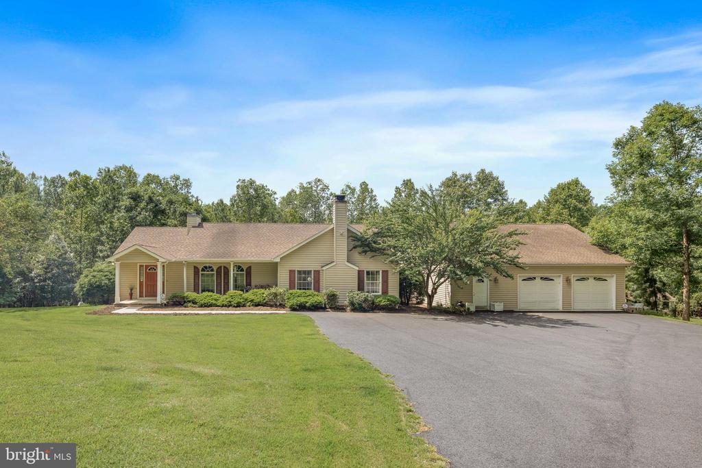 Welcome to 3930 Gilbert Station Rd””a private retreat on 6 peaceful acres, with a huge detached garage/workshop and no HOA! This charming one-level home is move-in ready and waiting for you. Step inside the home to the front entry room, with tile flooring and closets. The eat-in kitchen features stainless appliances, and steps out to the light-filled sunroom. The owner's suite includes a walk-in closet and en suite bathroom, with a tiled walk-in shower. A second bedroom and full bathroom are on the left side of the home. The third bedroom just needs a door, and is currently set up as a cozy den / family room, with a brick wood-burning fireplace, half bathroom, and separate laundry room. The two-car detached garage includes a private entryway, a conditioned workshop room (or office), and staircase to a large attic space, currently used as storage. Enjoy the outdoors on the covered front patio or the huge composite back deck, which overlooks the large backyard. A shed is in place with a run-in, perfect for a mower or outdoor tools. Enjoy country living with no HOA, while being not far from Preddy Creek Trail Park, NGIC, Charlottesville Albemarle Airport, shopping, vineyards, and more. Don't miss your chance to own this incredible pr