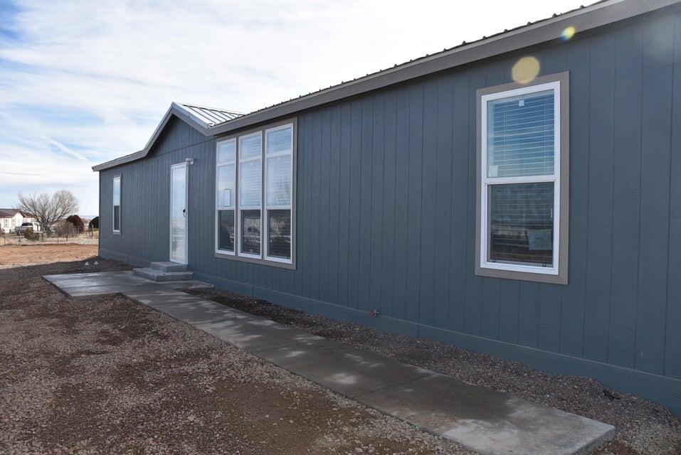Price REDUCED $10,00! Only 1 year 2024 Champion 3 bedroom (Possible 4 )  2 1/2 bath with Flex room for office or playroom.  On 0.75 Acres,, Pro-panel metal roof, brand new stainless appliances, Open Floor Plan, Extra  large kitchen, Oversized island perfect for barstool seating, , full tile backsplash in kitchen, extra large utility room with deep wash sink inside back door of home. Master bath double sink. MUST SEE!