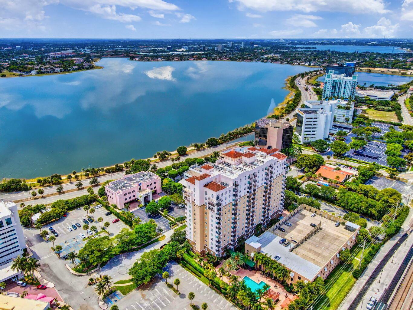 Fabulous 2-bed, 2-bath condo in the heart of West Palm Beach with stunning lake views from your private balcony! This light-filled home features tile flooring in the main living areas and cozy carpet in the bedrooms. The kitchen offers stainless steel appliances, granite countertops, and a spacious pantry. Both bathrooms include granite vanities and glass-enclosed tub/shower combos. Enjoy resort-style amenities including a 24-hour concierge, gated parking, fitness center, clubroom, and business center. Basic cable and internet are included--just bring your own router. All just minutes from The Square, Kravis Center, Convention Center, PBI Airport, and beautiful beaches!