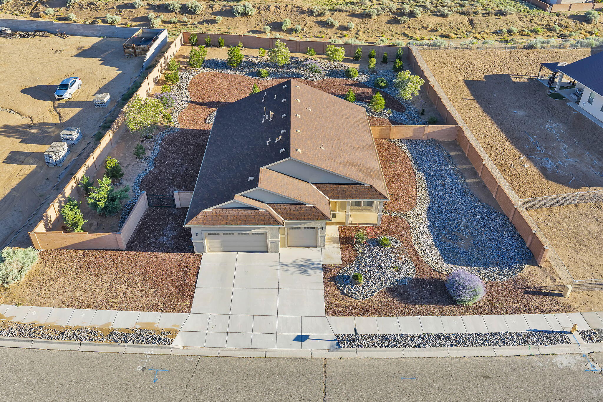 Welcome to this meticulously maintained home in Encantado Ridge, set on a half-acre lot. This property features 3 bedrooms, 2 bathrooms, 2 living areas, and a three-car garage--with the option to convert one space into a 4th bedroom if desired. The primary suite offers a generous layout with a walk-in shower, separate soaking tub, and ample room to relax. Enjoy mountain views from both the front porch and backyard, which is beautifully landscaped and includes a full irrigation system. With backyard access, the lot provides plenty of room for Recreational vehicles, trailers, or project space, ideal for anyone who needs extra functionality. Located just down the street from a neighborhood park and within five minutes of three schools, plus easy access to shopping, dining, and every amenity.