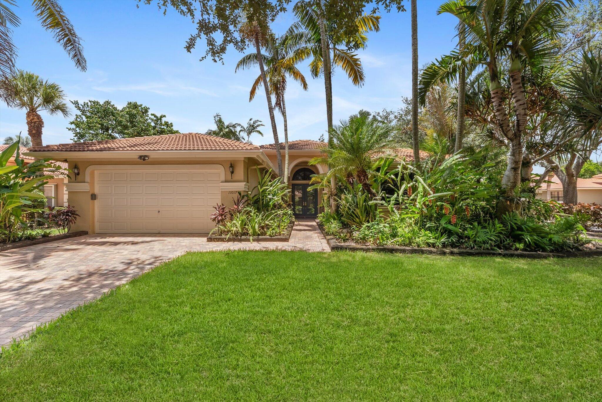 Welcome to your personal oasis, an impeccably maintained and move-in ready residence nestled in one of the most vibrant 55+ communities. From the moment you arrive, you'll be captivated by the lush tropical gardens, exotic fruit trees (including Portuguese grapes, mango, starfruit, and passionfruit), and a serene backyard that offers both tranquility and resort-style entertaining. Enjoy Florida living at its finest with your private dipping pool equipped with jets, spa features, and an air blower system. Host unforgettable gatherings in the fully equipped outdoor summer kitchen with sleek stainless steel appliances. This immaculate 3-BR plus den/office, 2.5-BA home showcases tasteful updates throughout: engineered hardwood and tile flooring, a spacious chef's kitchen with stainless steel appliances overlooking the family room, and a whole-house water filtration system. The expansive primary suite is a luxurious retreat with oversized walk-in closets featuring custom built-in drawers and electric Roman shades for added convenience and style.

Additional highlights include hurricane shutters throughout, a beautifully tiled garage with built-in cabinetry, and a NEW ROOF installed in 2019&#x14;ensuring peace of mind for years to come.

Located within a highly active 55+ community offering top-tier amenities: a clubhouse, state-of-the-art fitness center, game room, and more.