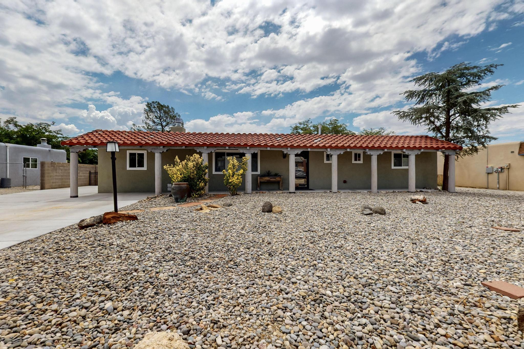 Welcome to your new home with mountain views! Beautifully remodeled and ready to move in. Southwest charm in quiet Corrales Heights. Great room with a new fireplace opens to a lovely ''Cooks Kitchen'' and dining area. The den can easily be converted to a 3rd bedroom. Rehabbed between 2023-2025. Stainless steel appliances, new bathrooms, luxury vinyl wood plank floors, new windows and doors. Refrigerated air. Too many upgrades to list. Spacious back yard. Watch the Balloon Fiesta from your back porch.